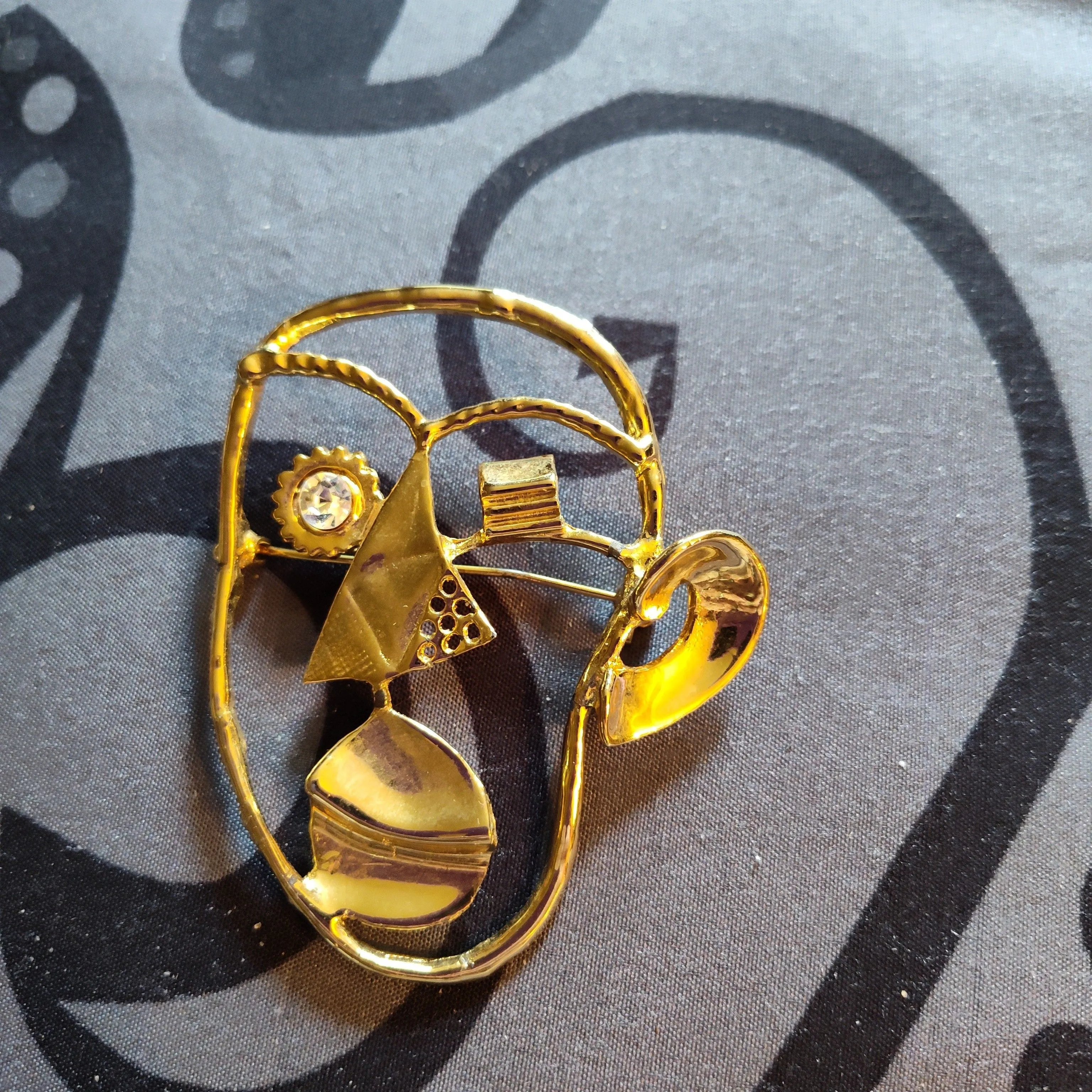Product image for gold tone abstract face brooch 