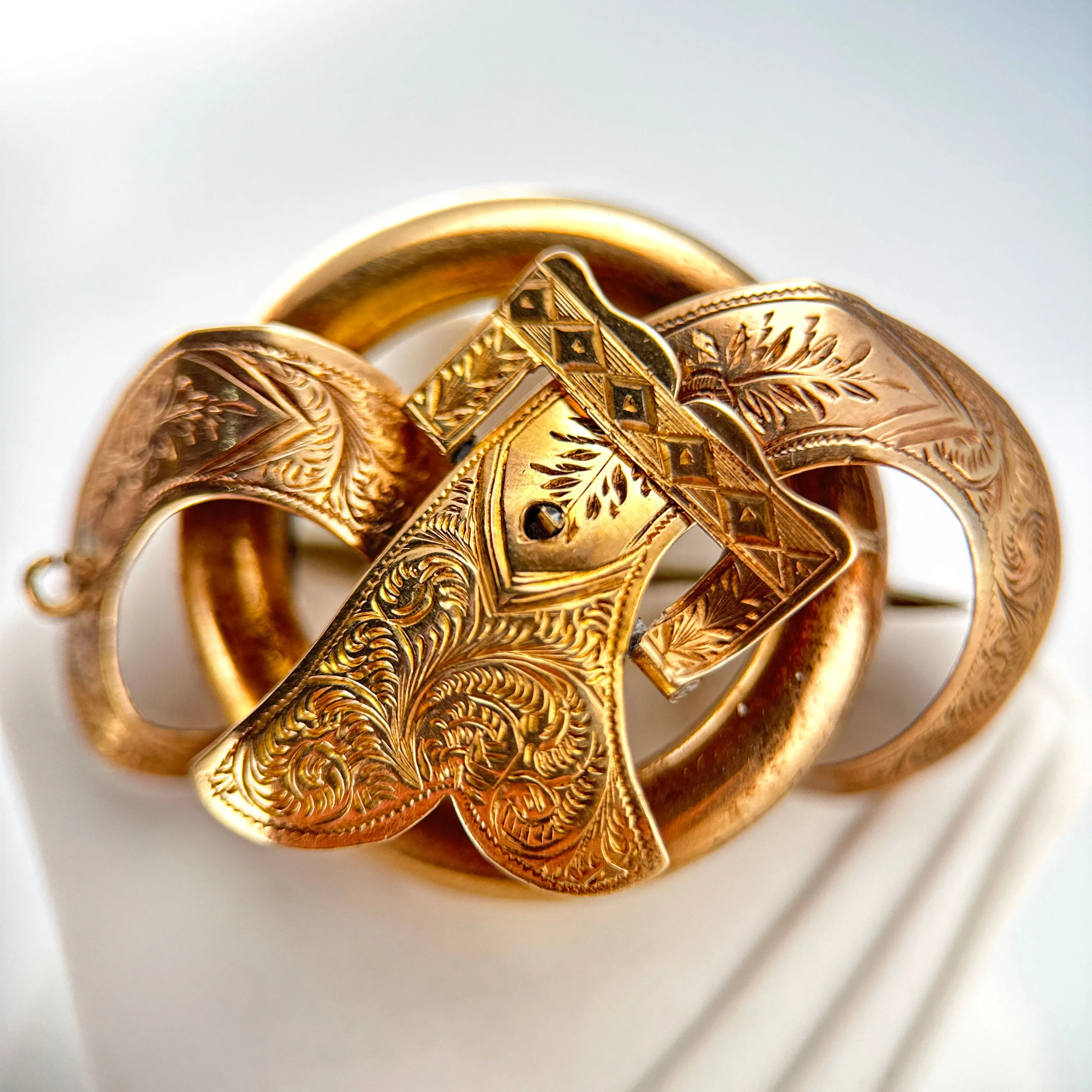 Product image for Victorian 9k Gold Love Knot Brooch/Pendant with Intricate Floral Engraving and Hinged 'Buckle' Detail 1.5" x 1" 5.1g  YYX0076