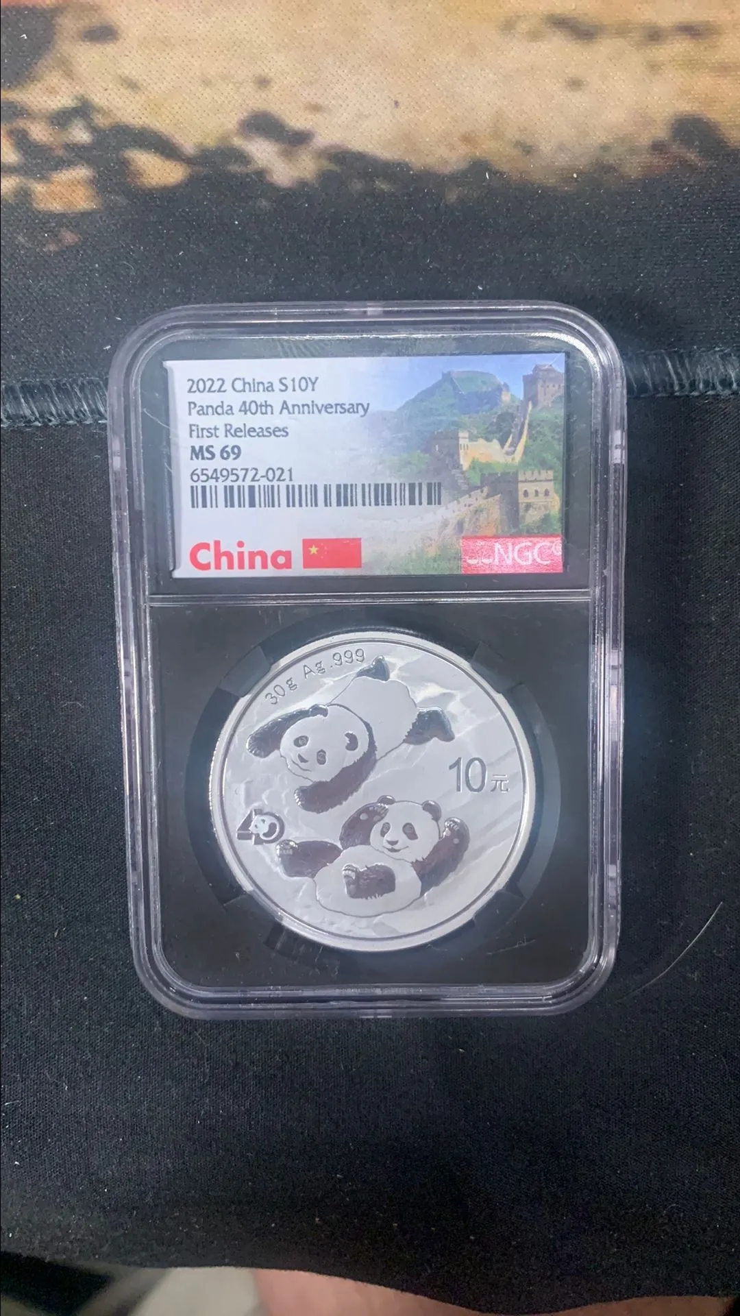 Product image for 2022 PANDA 40TH ANNIVERSARY FIRST RELEASES MS 69 GREAT WALL LOGO 1oz Silver Coin NGC MS69