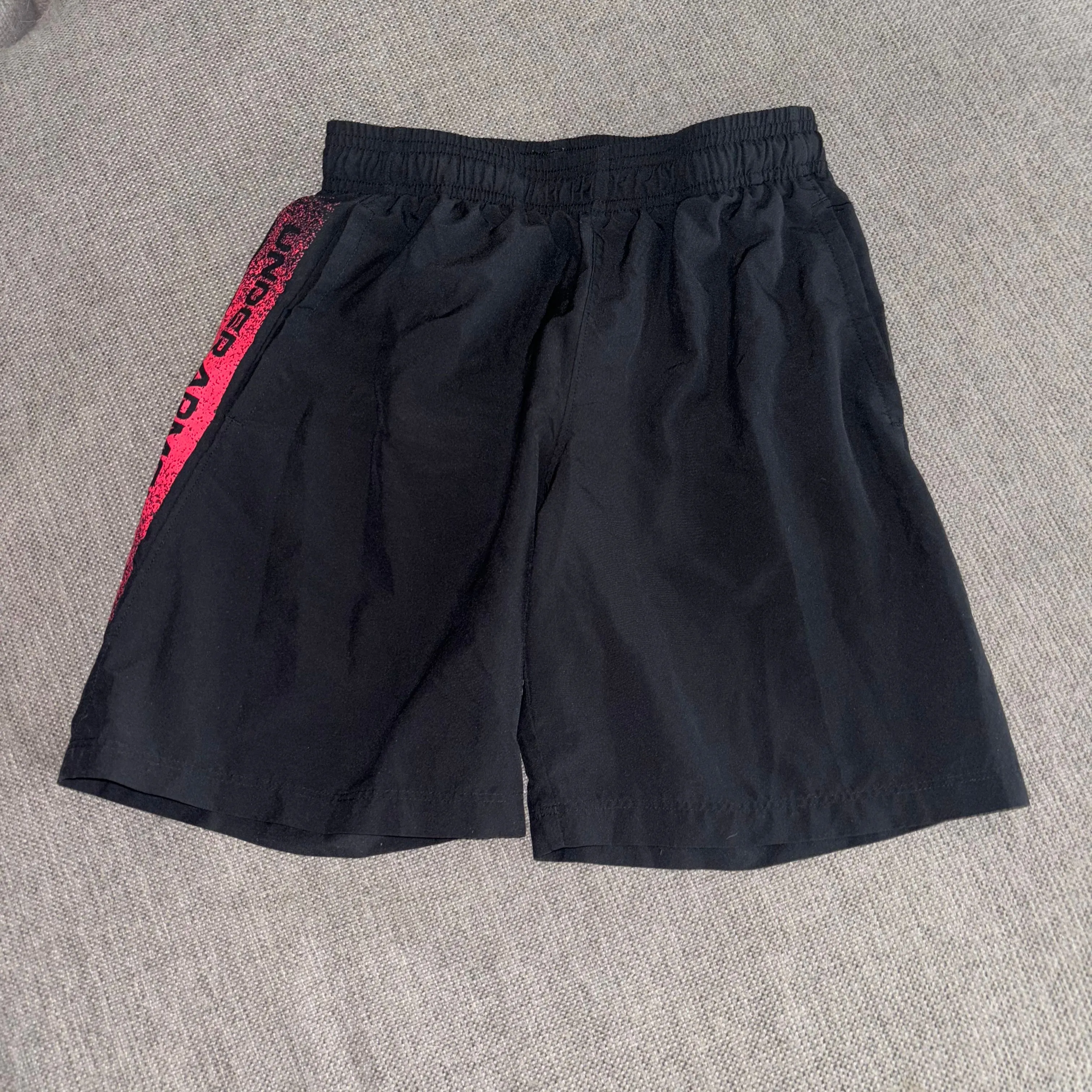 Product image for Under Armour athletic elastic waist black shorts, size 10-12, youth medium