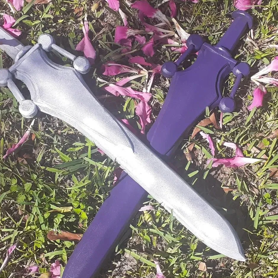 Product image for pair of handmade EVA foam attorney in power swords He-Man split Skeletor variant