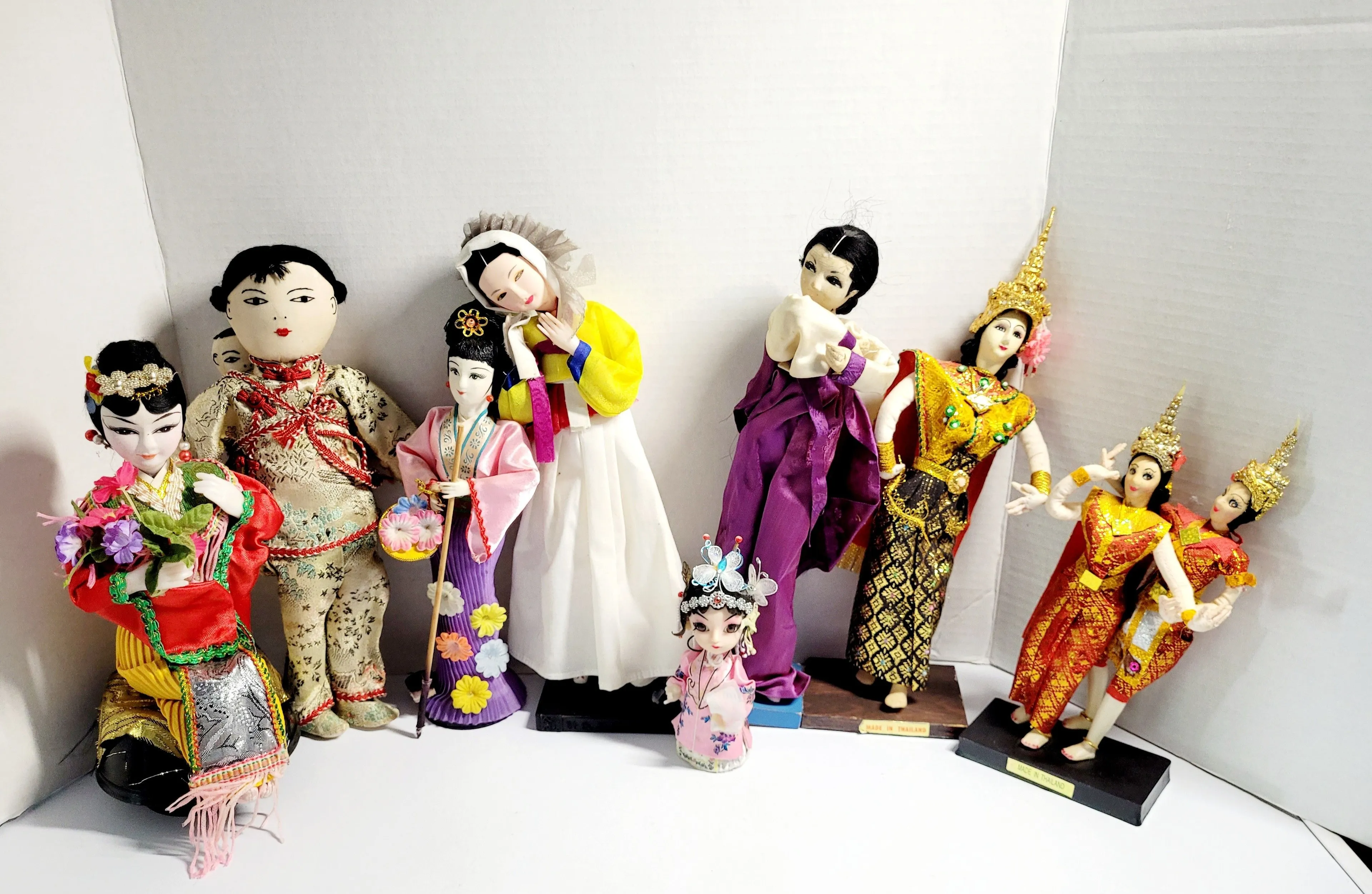 Product image for (Lot Of 9) Vintage Collection Of Traditional Dolls From East and Southeast Asia. The image displays 