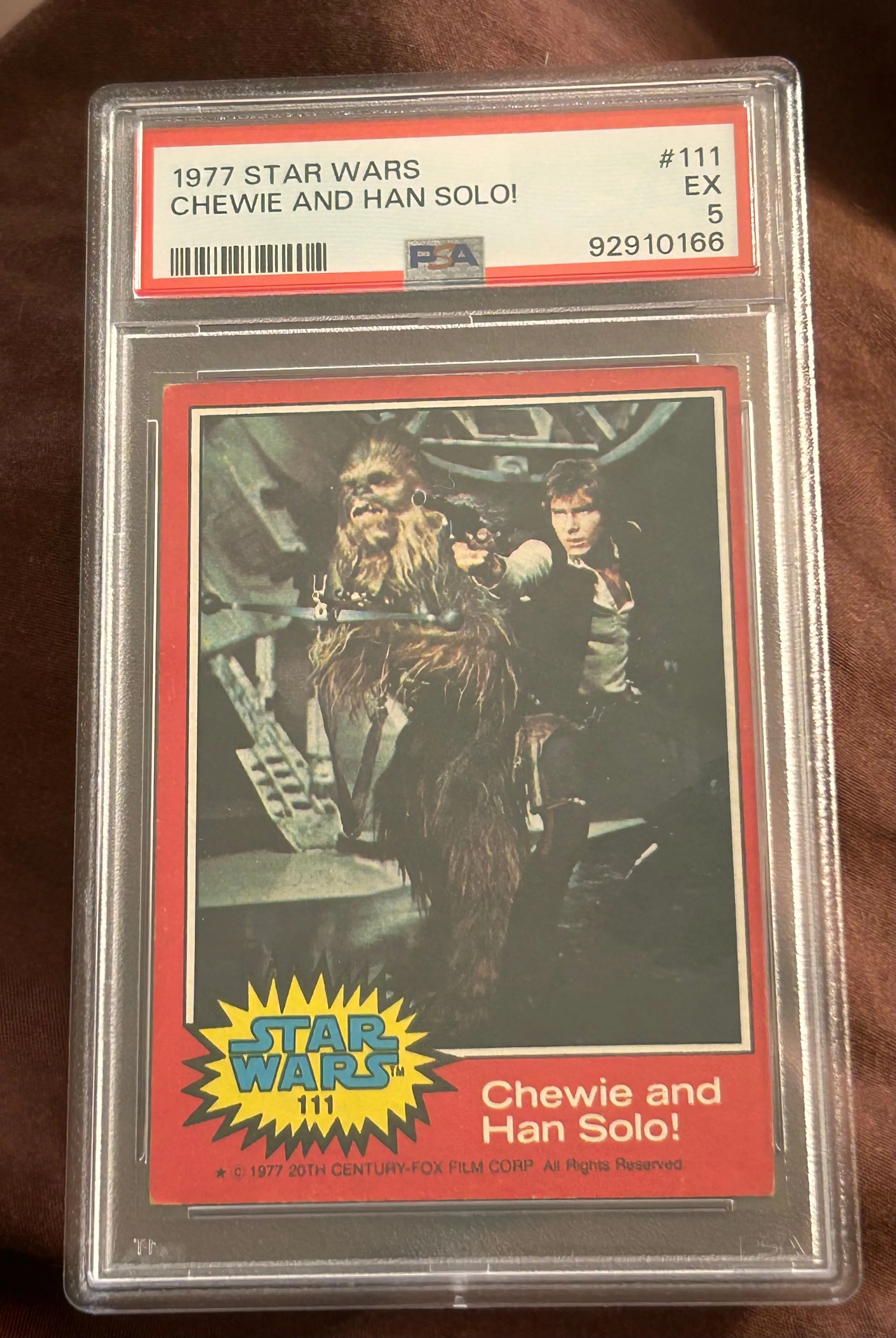 Graded 1977 Star Wars trading card featuring Chewie and Han Solo,  specifically card #111 from the "R  Whatnot: Shop, Sell, Connect