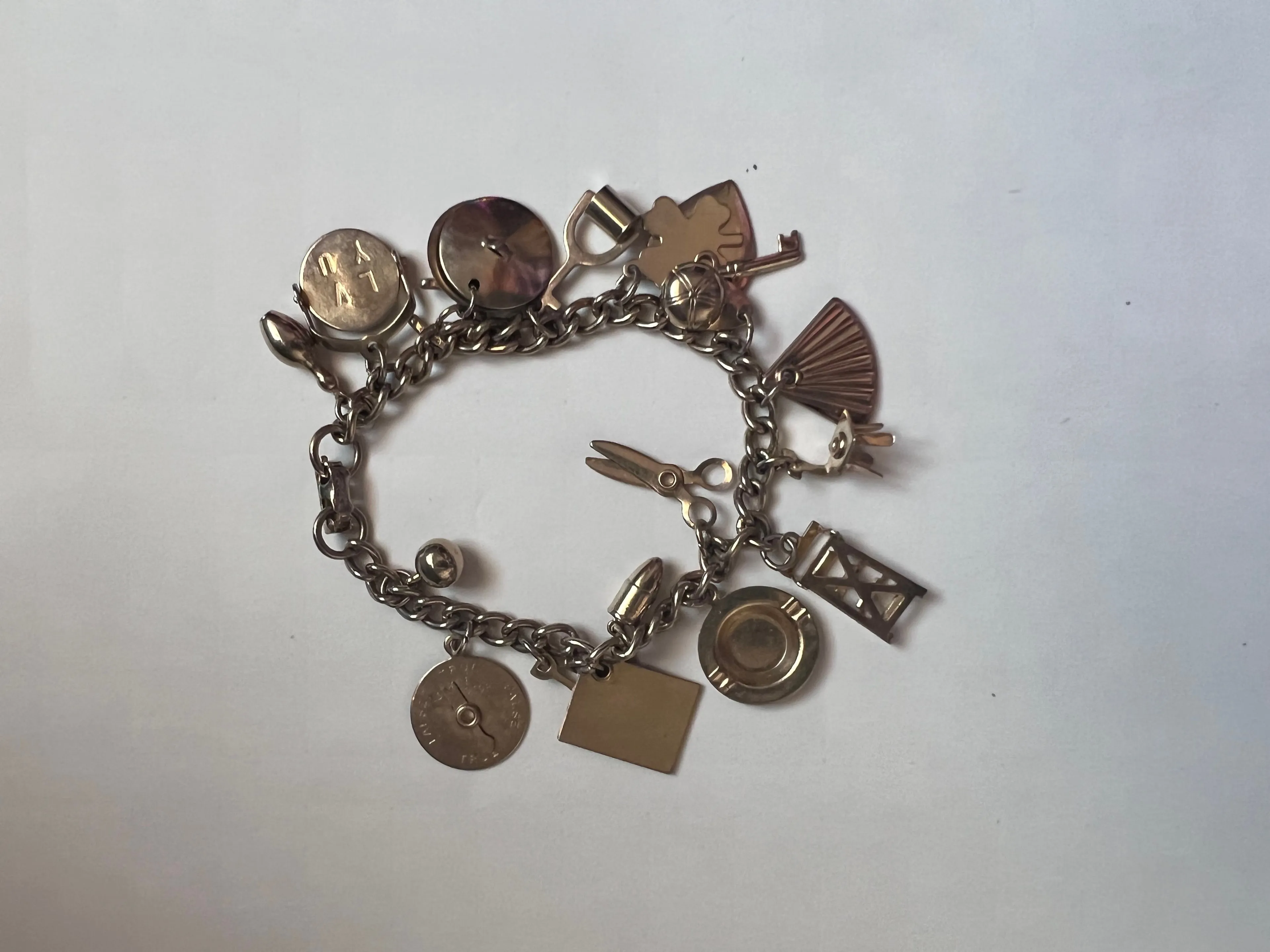 Product image for Vintage Signed CORO Gold Tone 18 Charm Bracelet