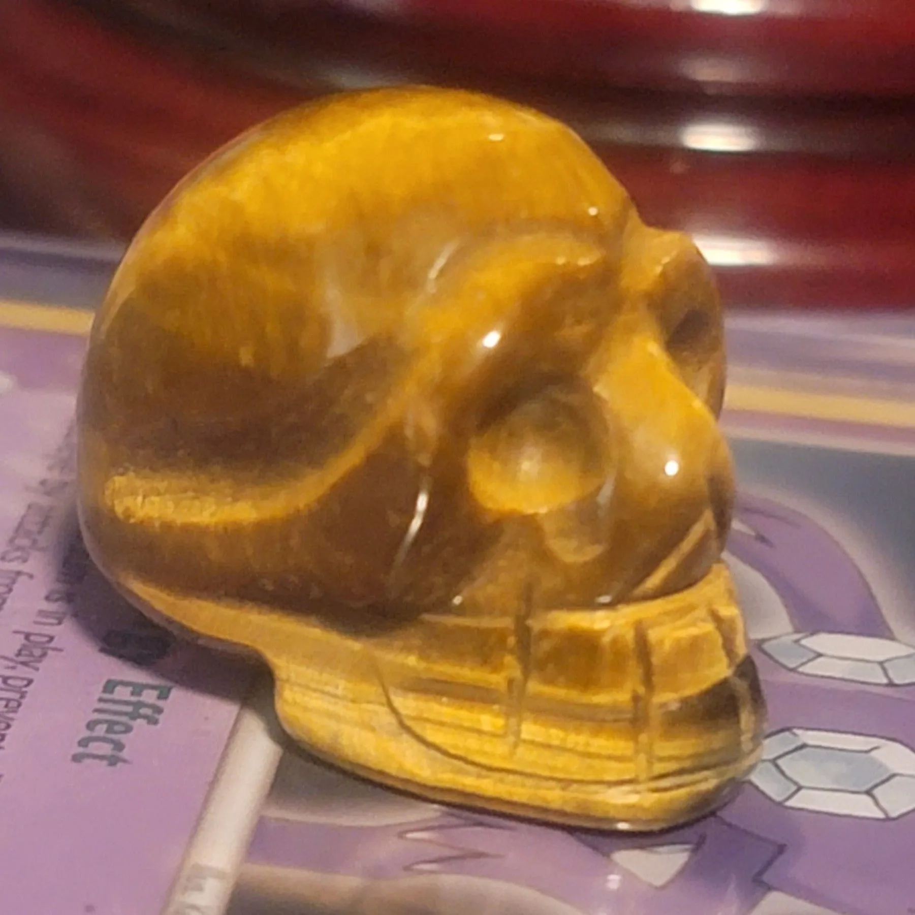 Product image for TIGERS EYE HAND CARVED SKULL - HELP GROW CONFIDENCE AND COURAGE - THE STONE OF STRENGTH