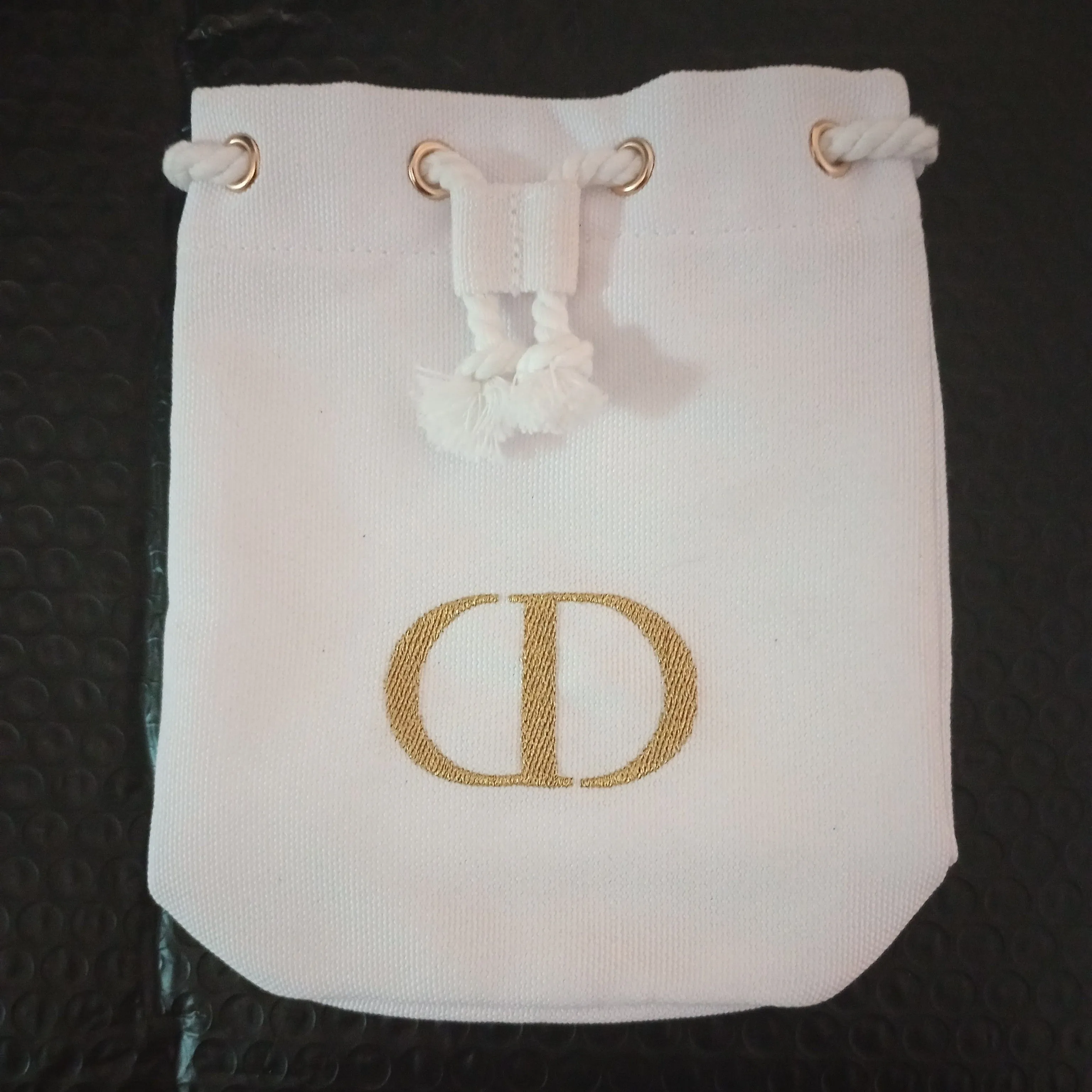Product image for Christian Dior luxury Drawstring Pouch white with GOLD logo letter