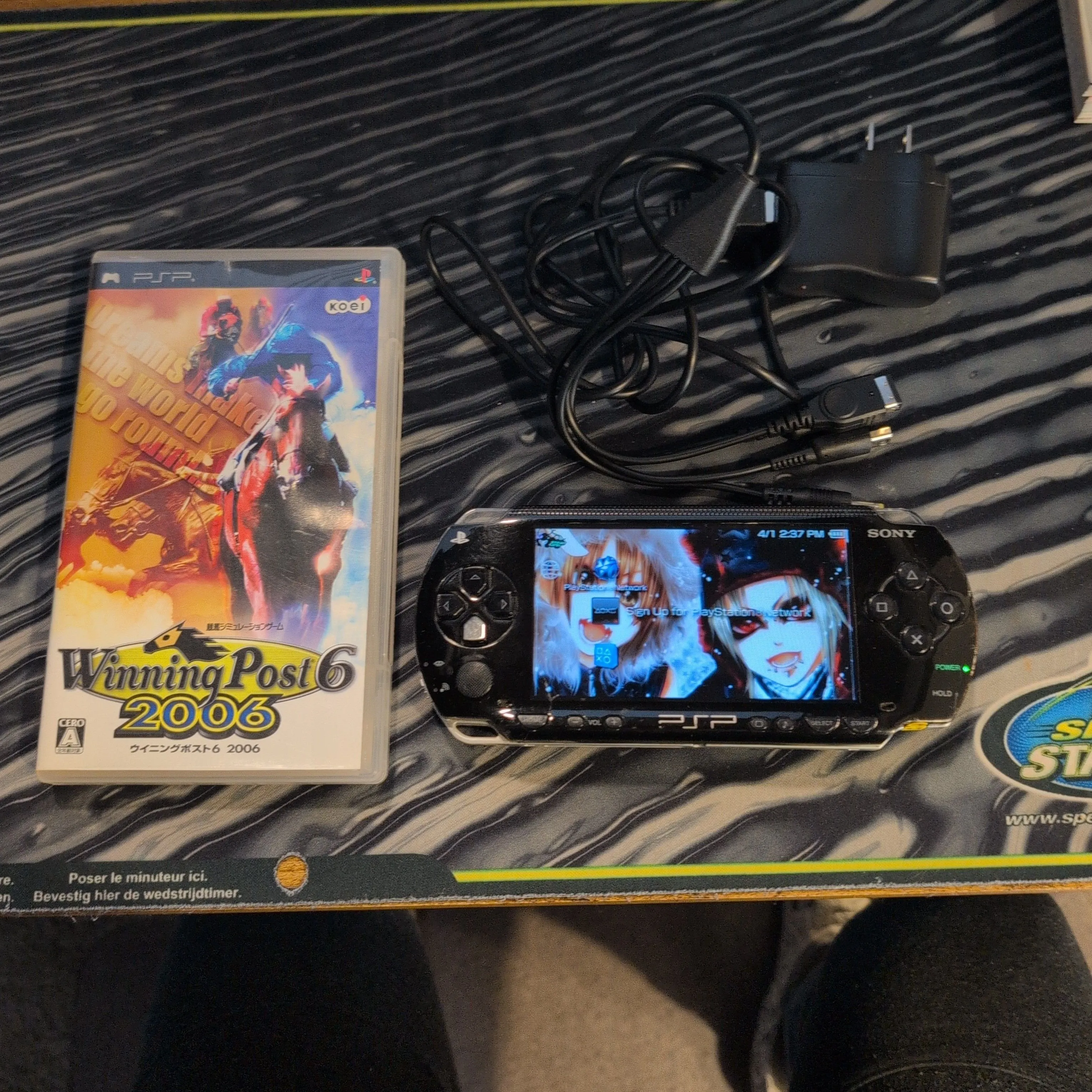 Product image for PSP 1001 with charger and 2 games