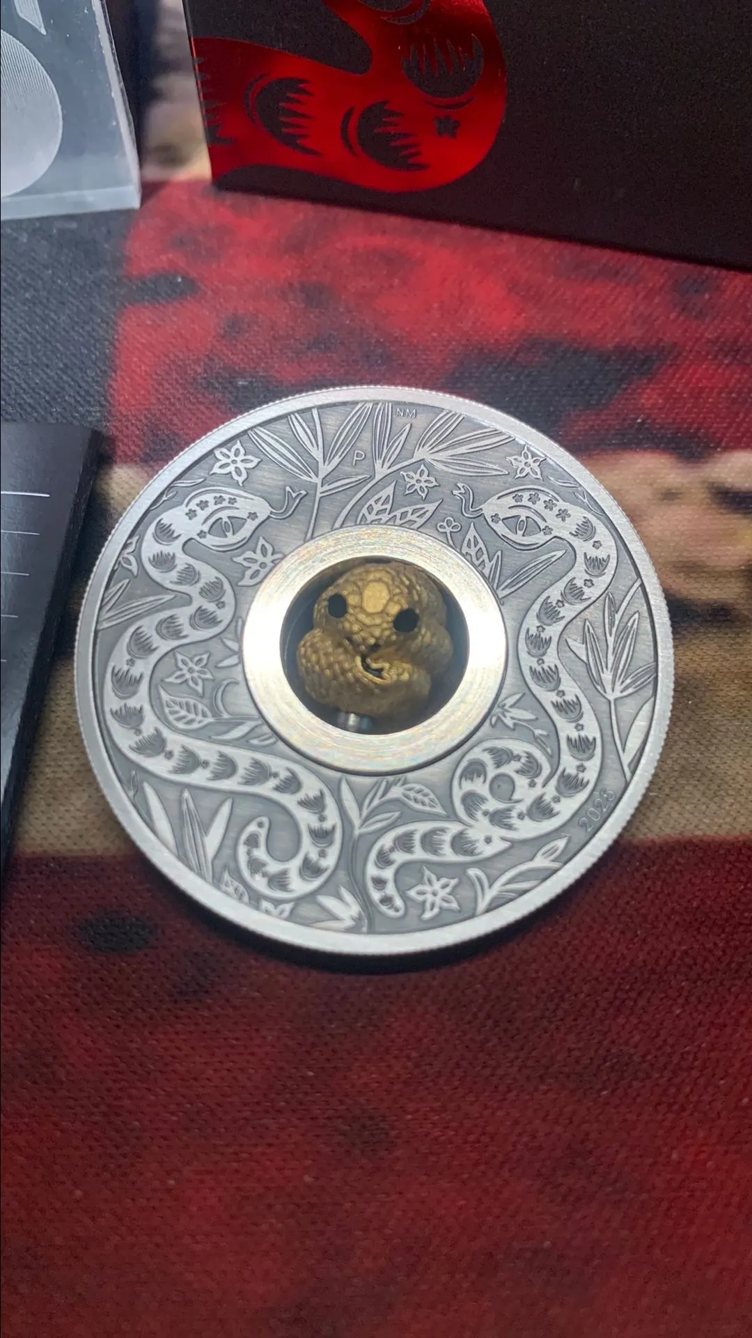 Product image for 2025 AUSTRALIA 1 OZ ANTIQUED SILVER YEAR OF THE SNAKE W/ ROTATING CHARM COIN OGP