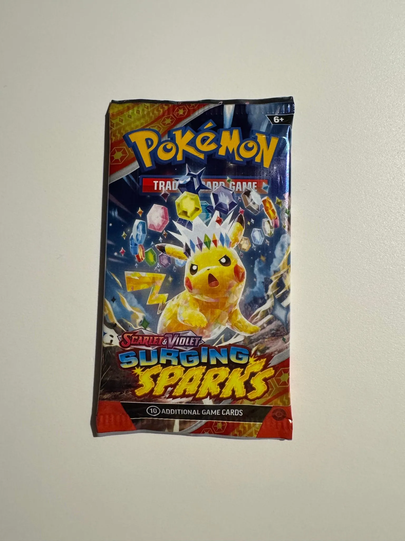 Pokmon Surging Sparks booster pack  Whatnot: Shop, Sell, Connect