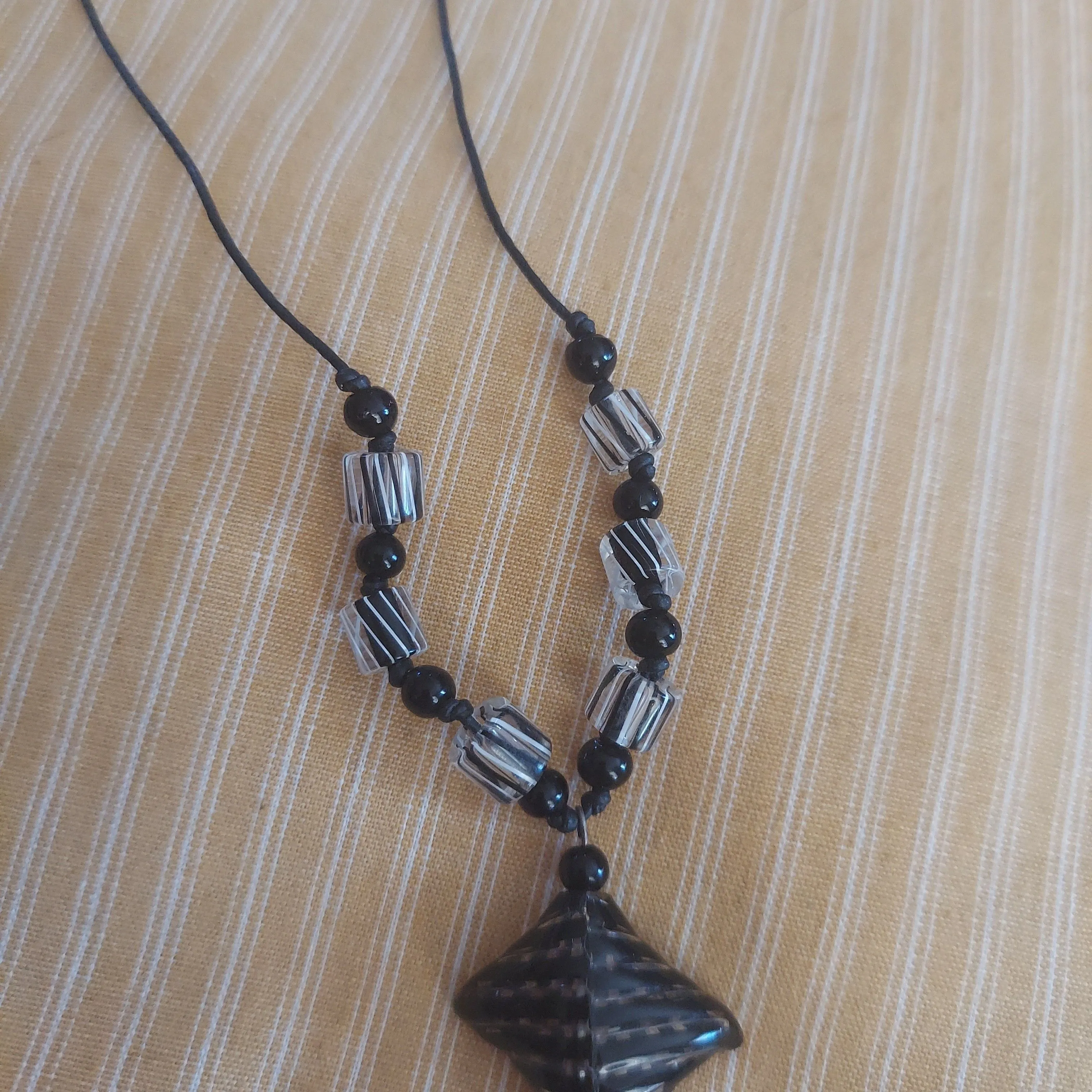 Product image for plastic and chord bead necklace
