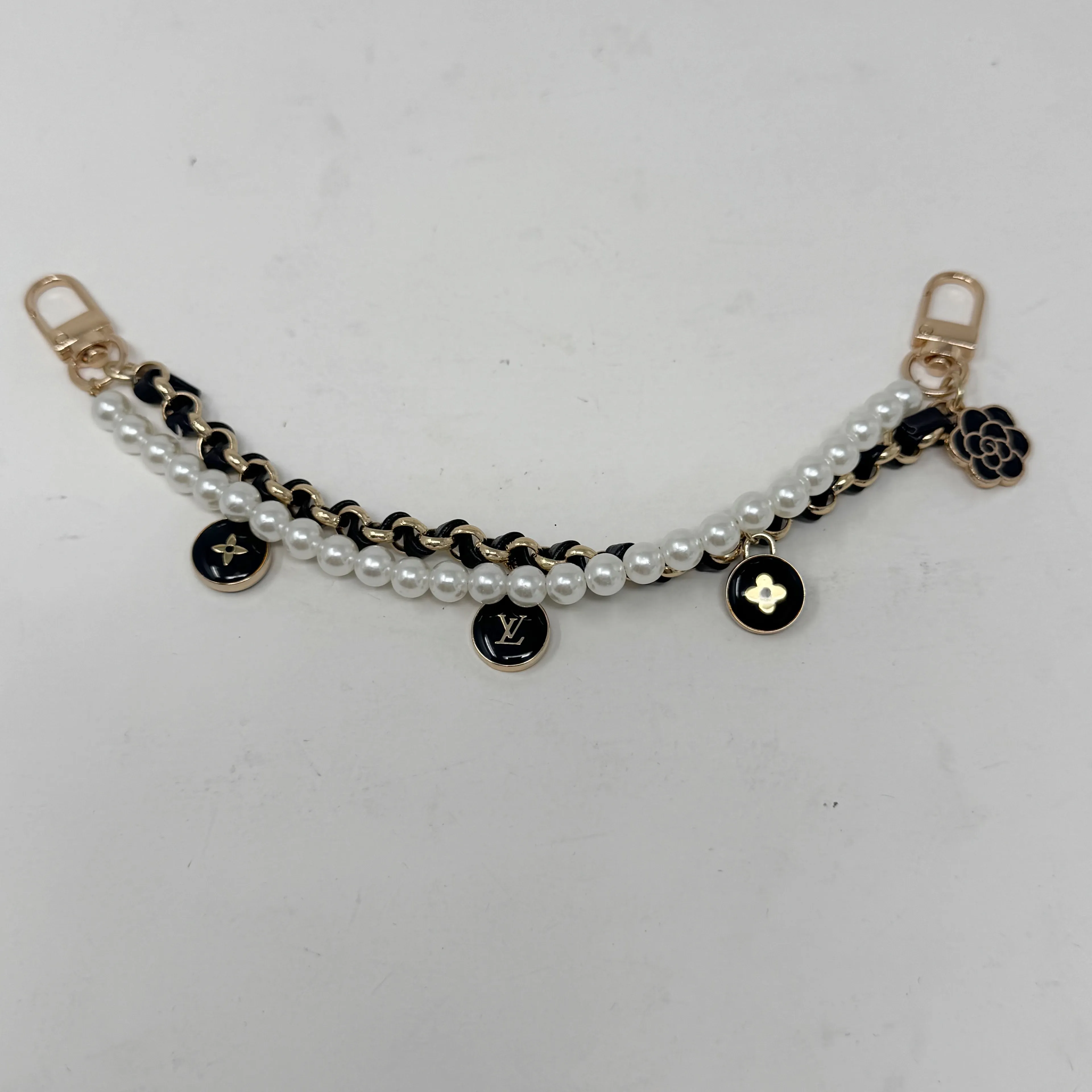 Product image for LOUIS VUITTON LV Upcycled Bag Charm Black & Gold