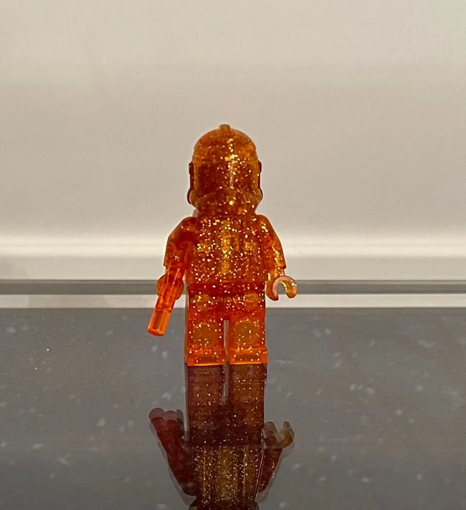 Product image for LEGO SW Monochrome Minifigure - Glitter Orange P2 Clone Trooper w/trans orange blaster - Unreleased