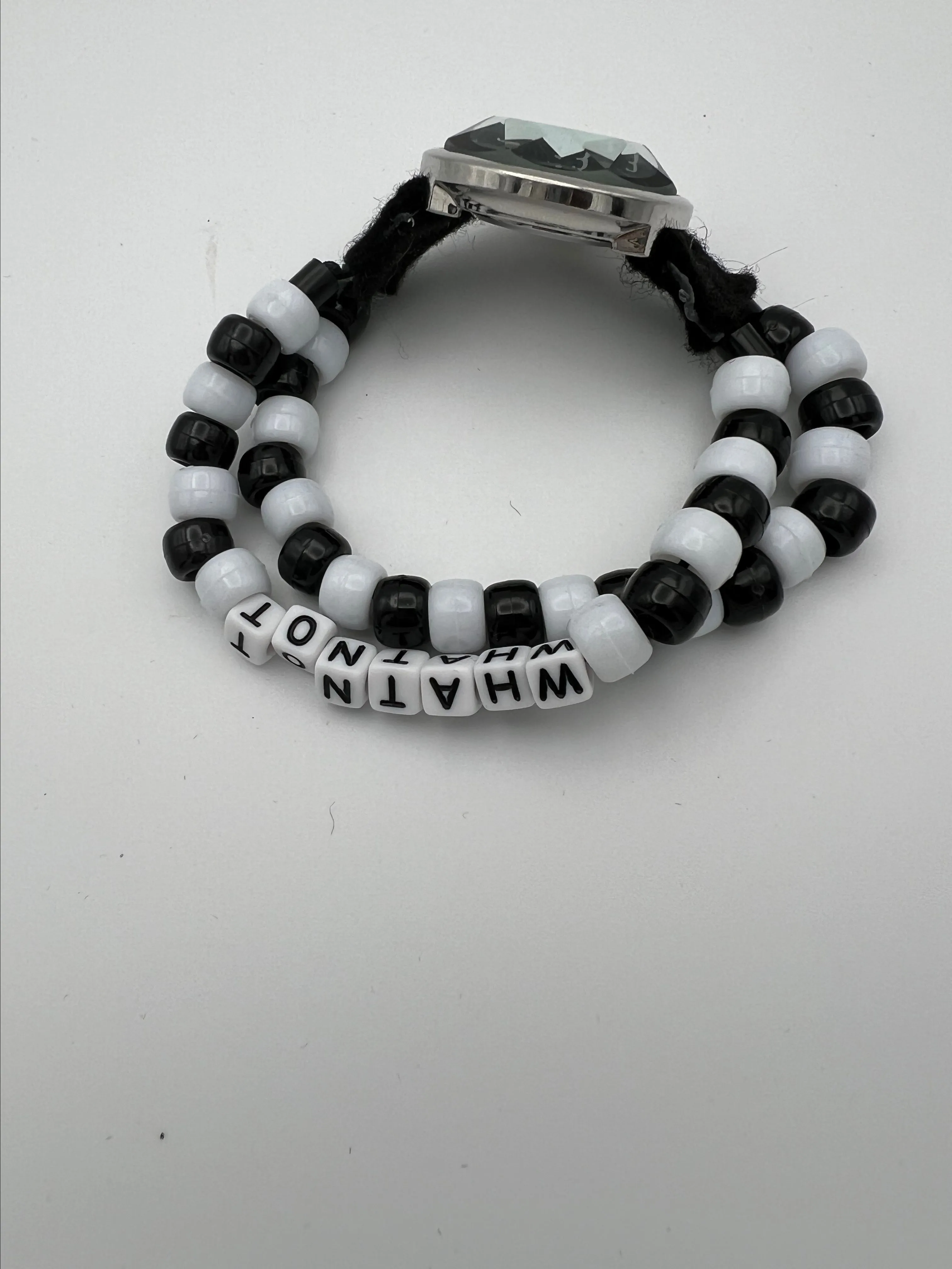 Product image for Handmade band has 'Whatnot' spelled out in beads