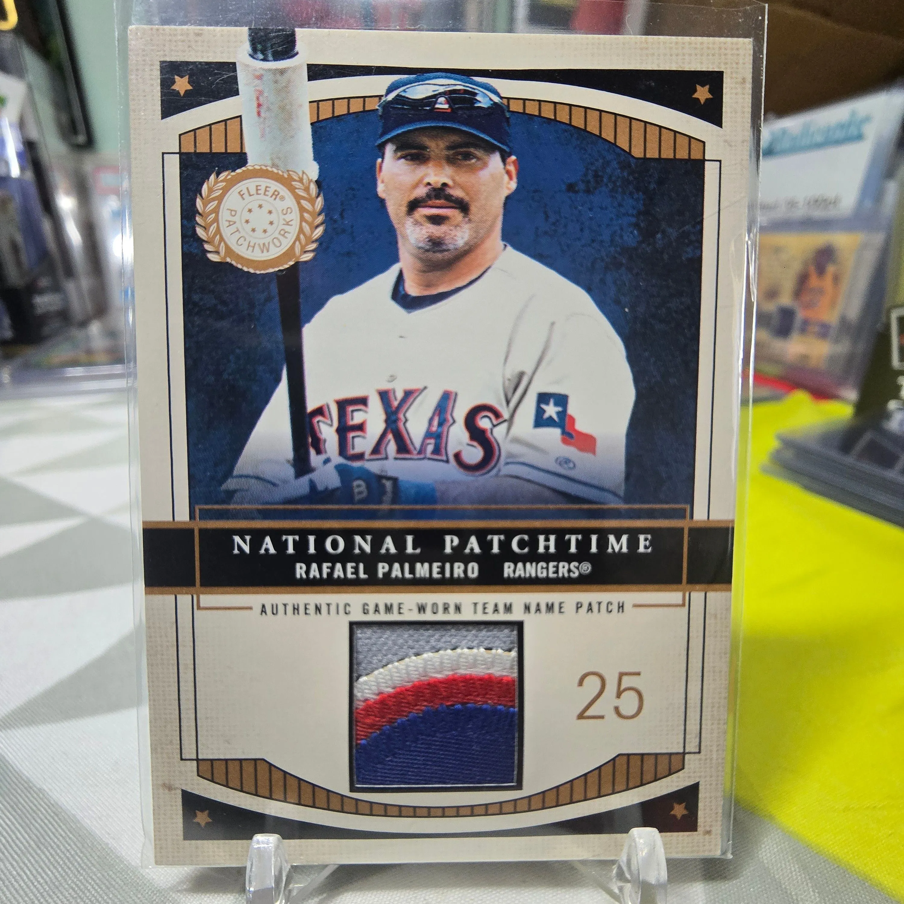 Product image for 2003 Fleer Patchworks National Patchtime /100 Rafael Palmeiro #NPT-RP2 Patch PICS