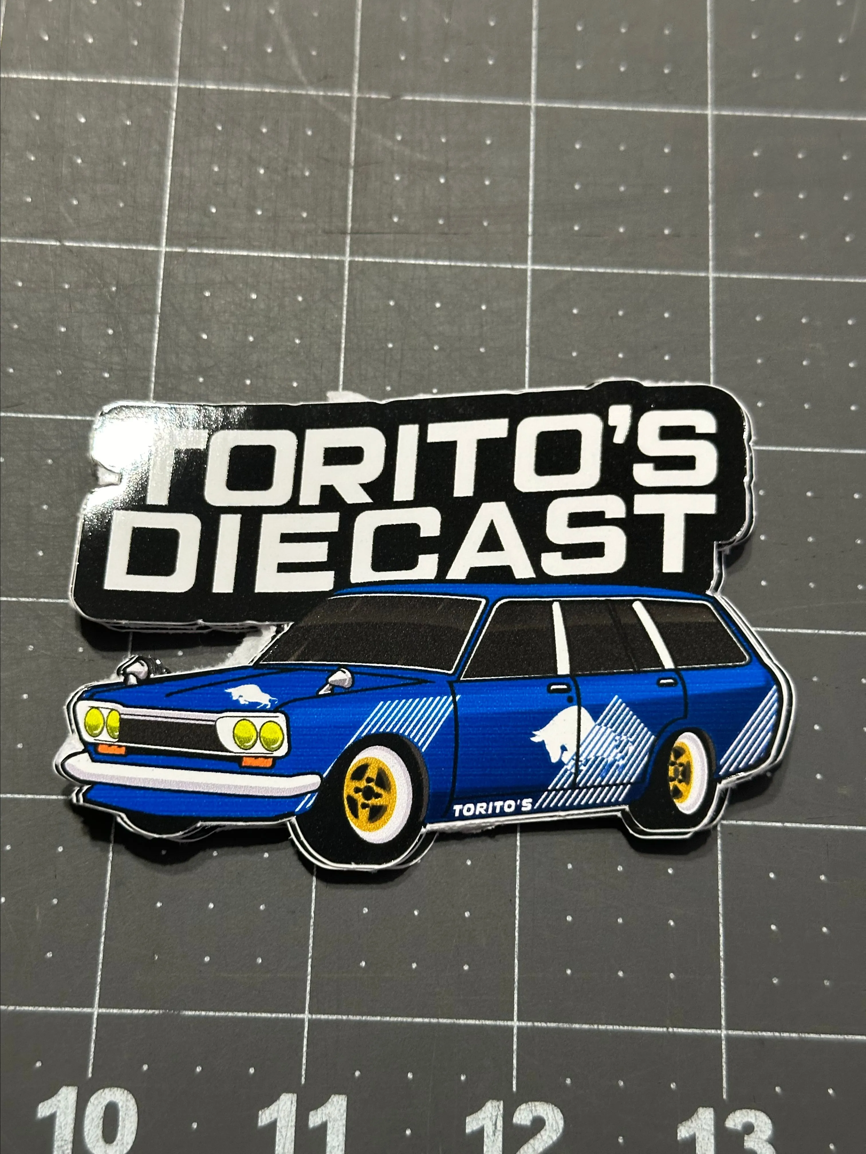 Product image for Blue Datsun wagon 510 toritos diecast sticker.