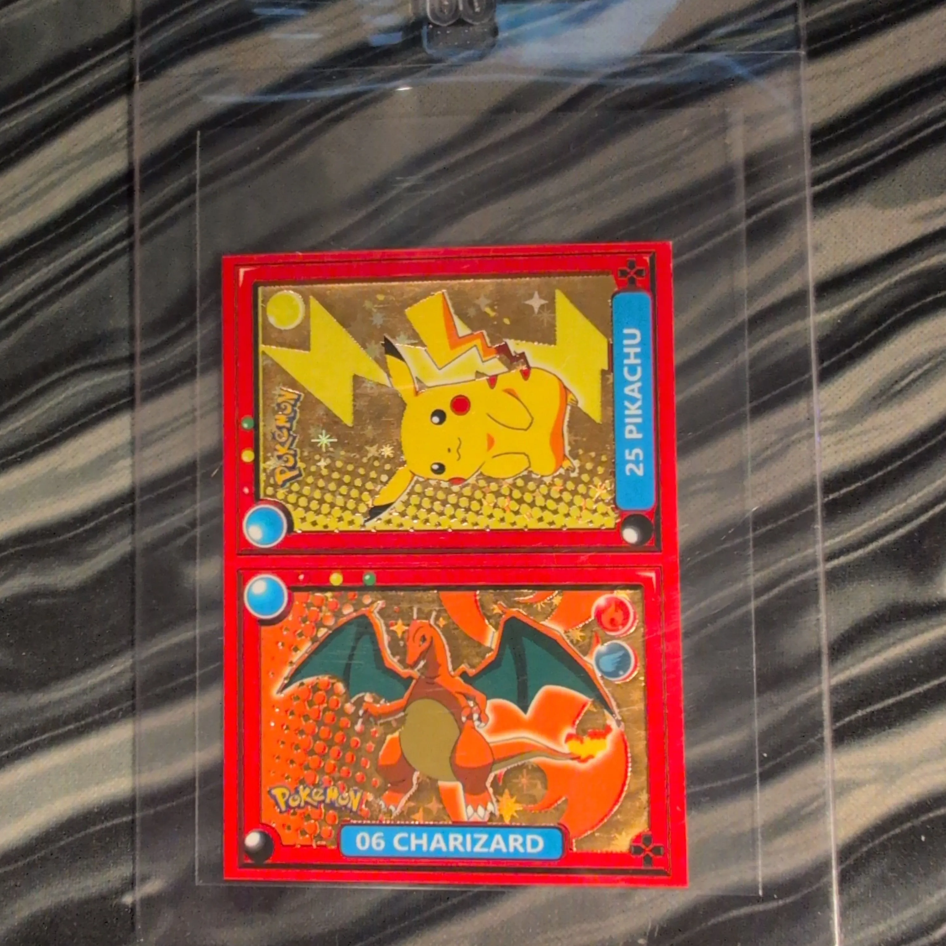 Product image for Charizard x Pikachu gold star foil Pokedex