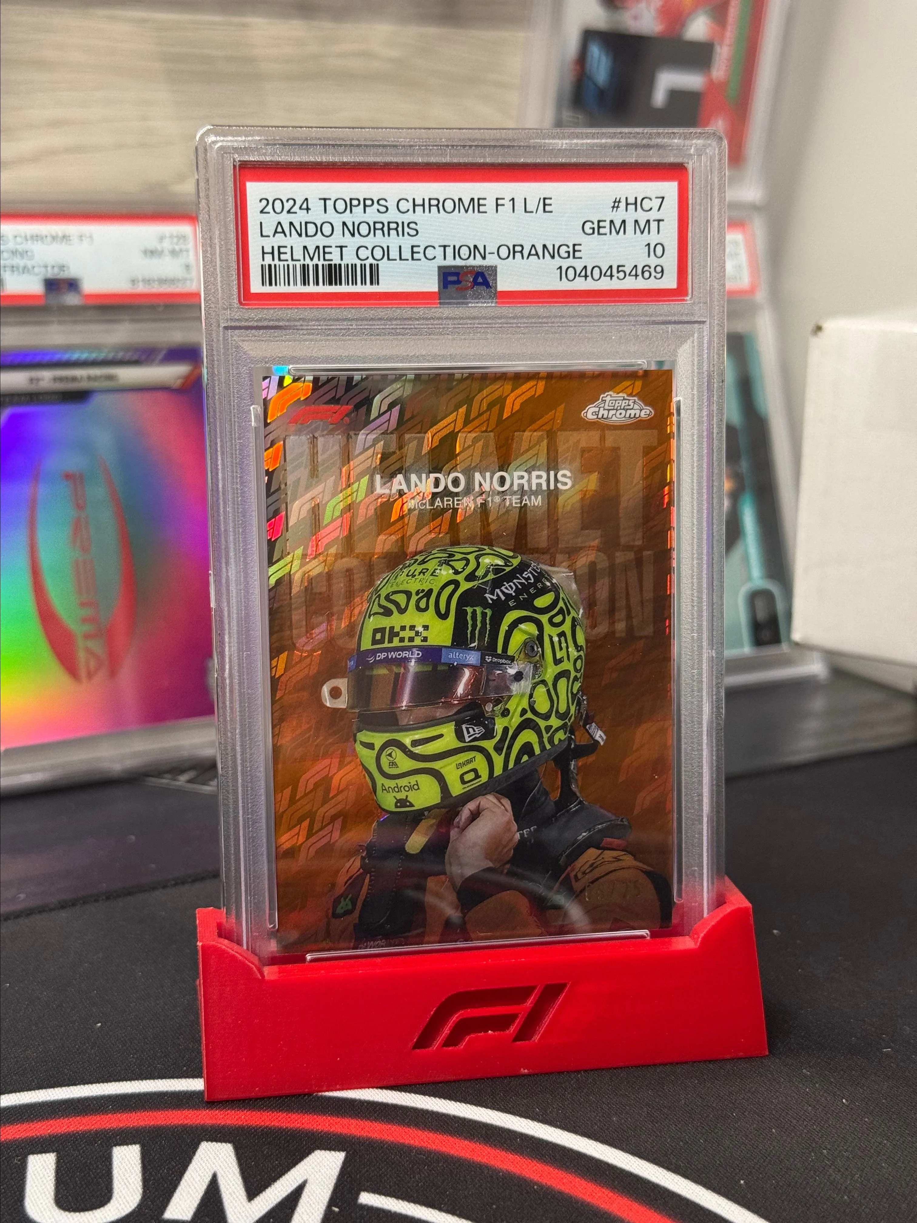 Product image for 2024 Topps Chrome Formula 1 Logofractor - Lando Norris Orange Helmet /25 PSA 10