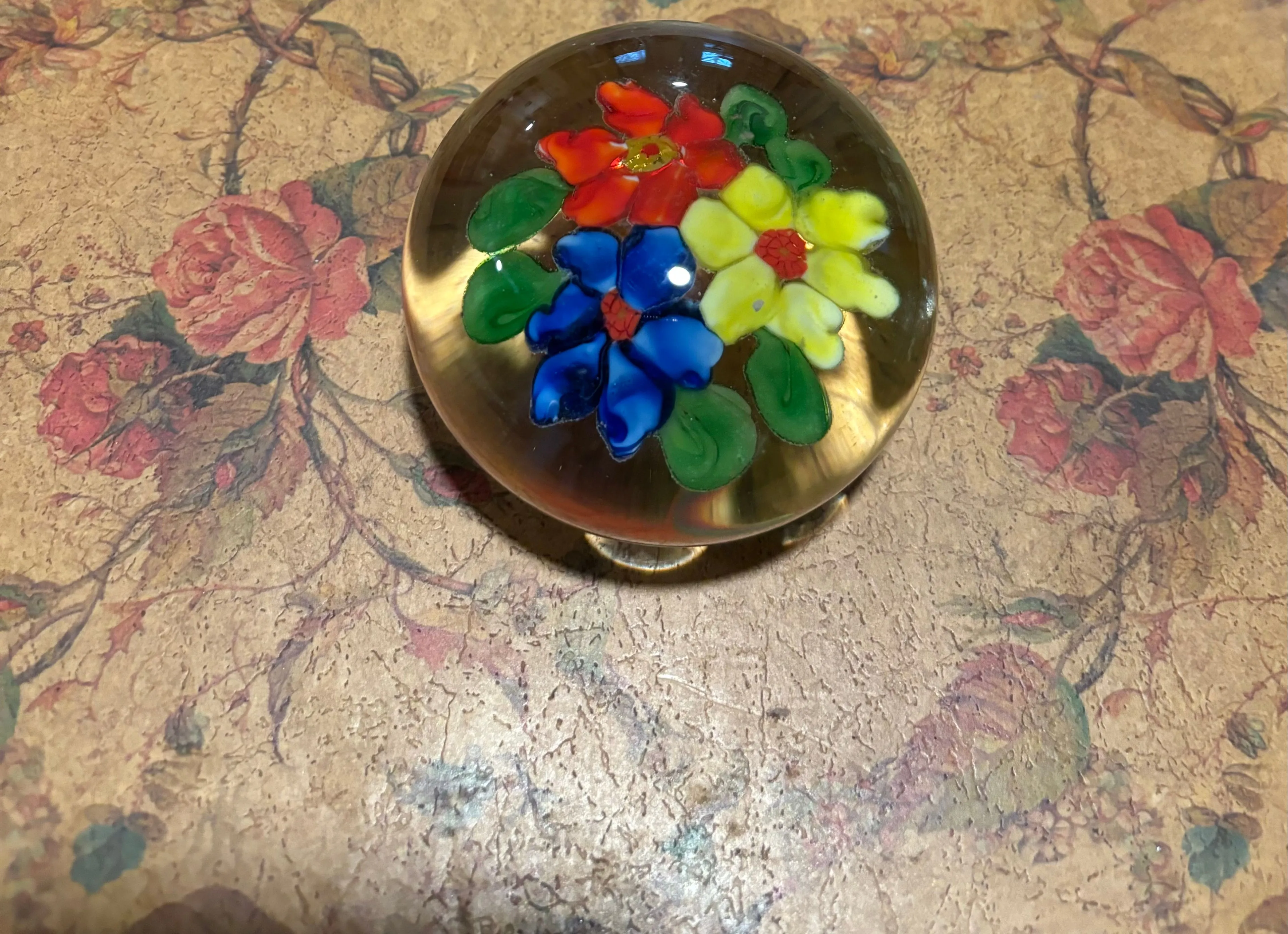 Product image for Art glass paperweight with red, yellow and blue flowers