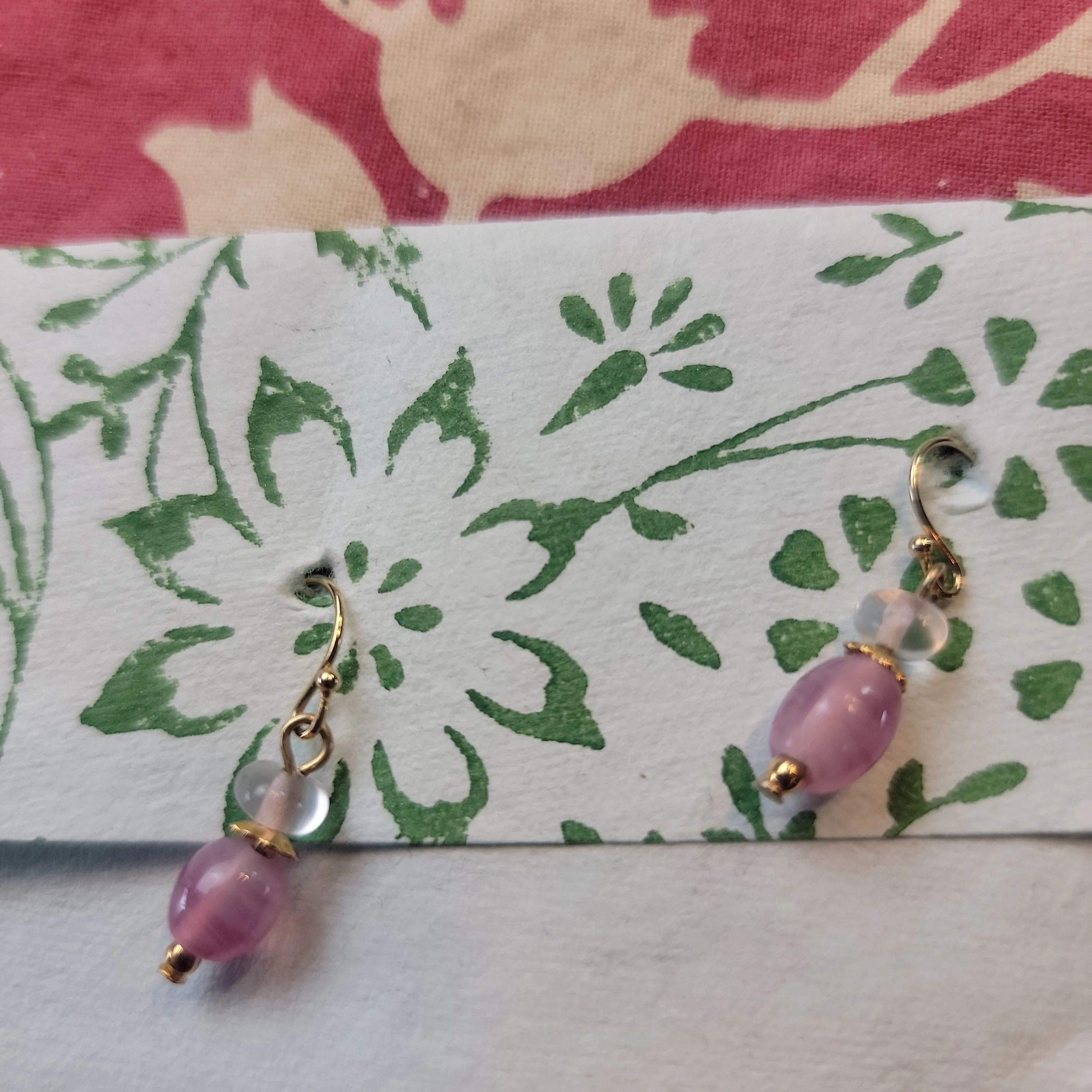 Product image for small dangles, pink, cleat and gold colored,