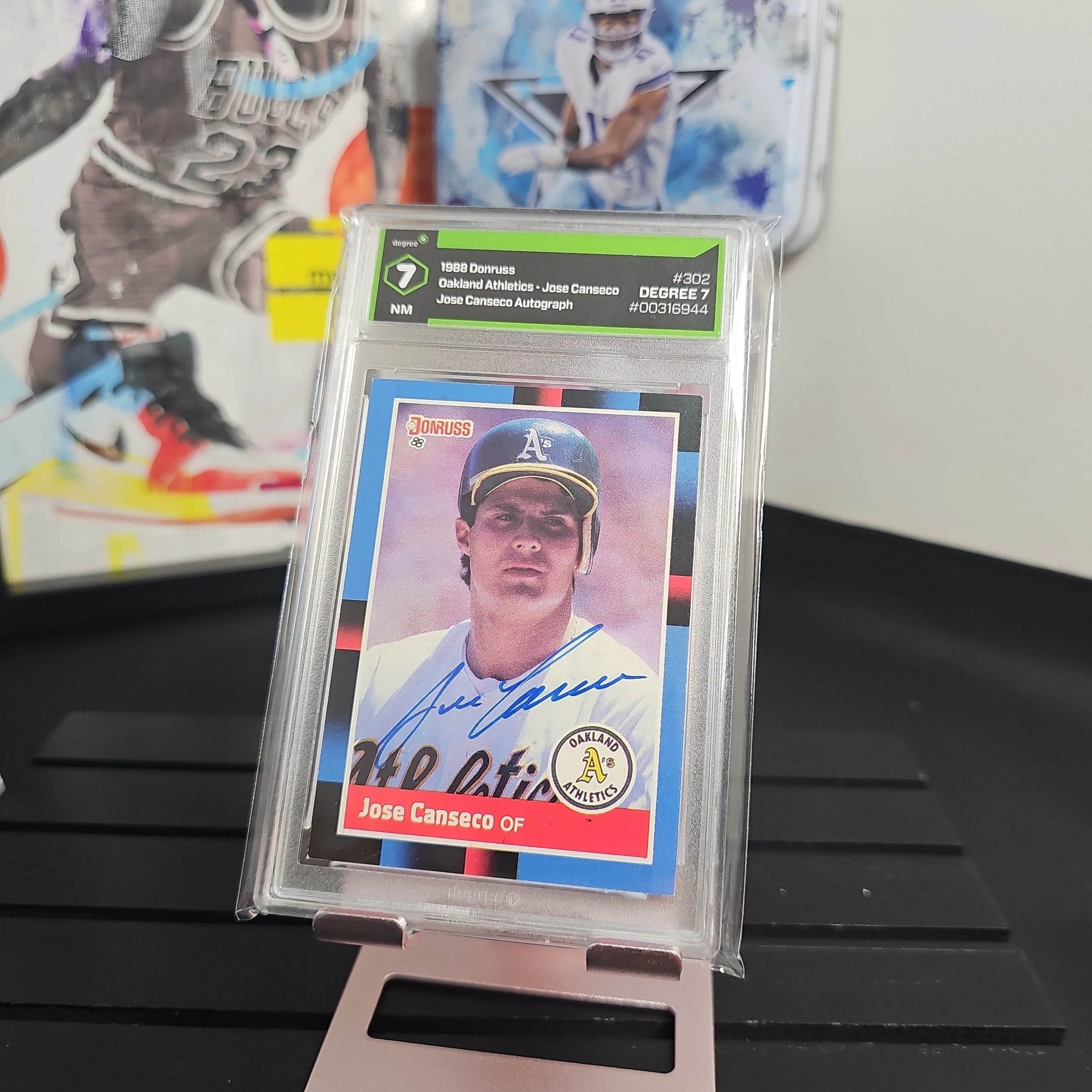 Product image for JOSE CANSECO 1988 DONRUSS SIGNED AUTOGRAPHED CARD #302 OAKLAND A'S Degree MN 7