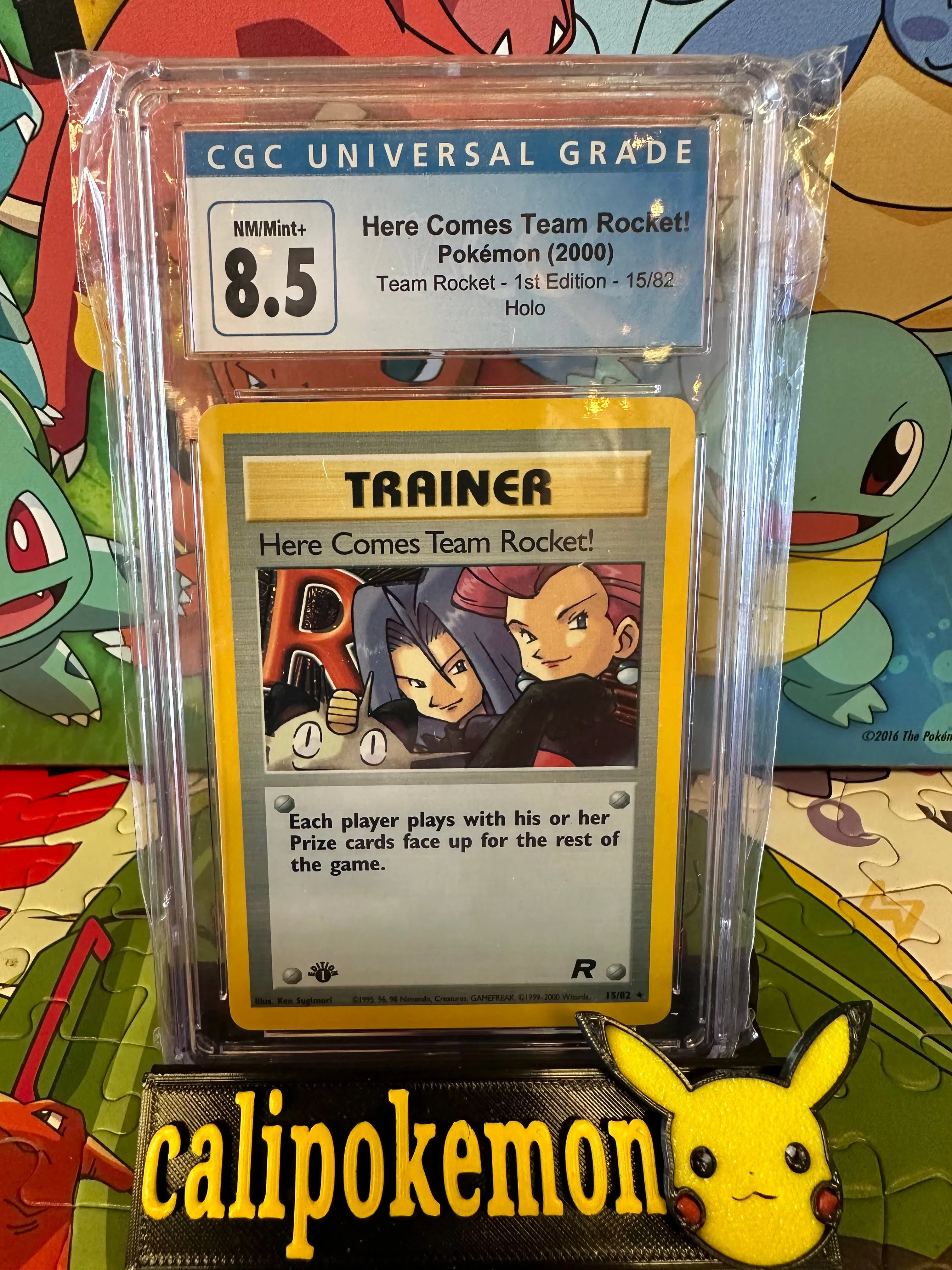 Product image for Here Comes Team Rocket 1st edition 15/82 CGC 8.5