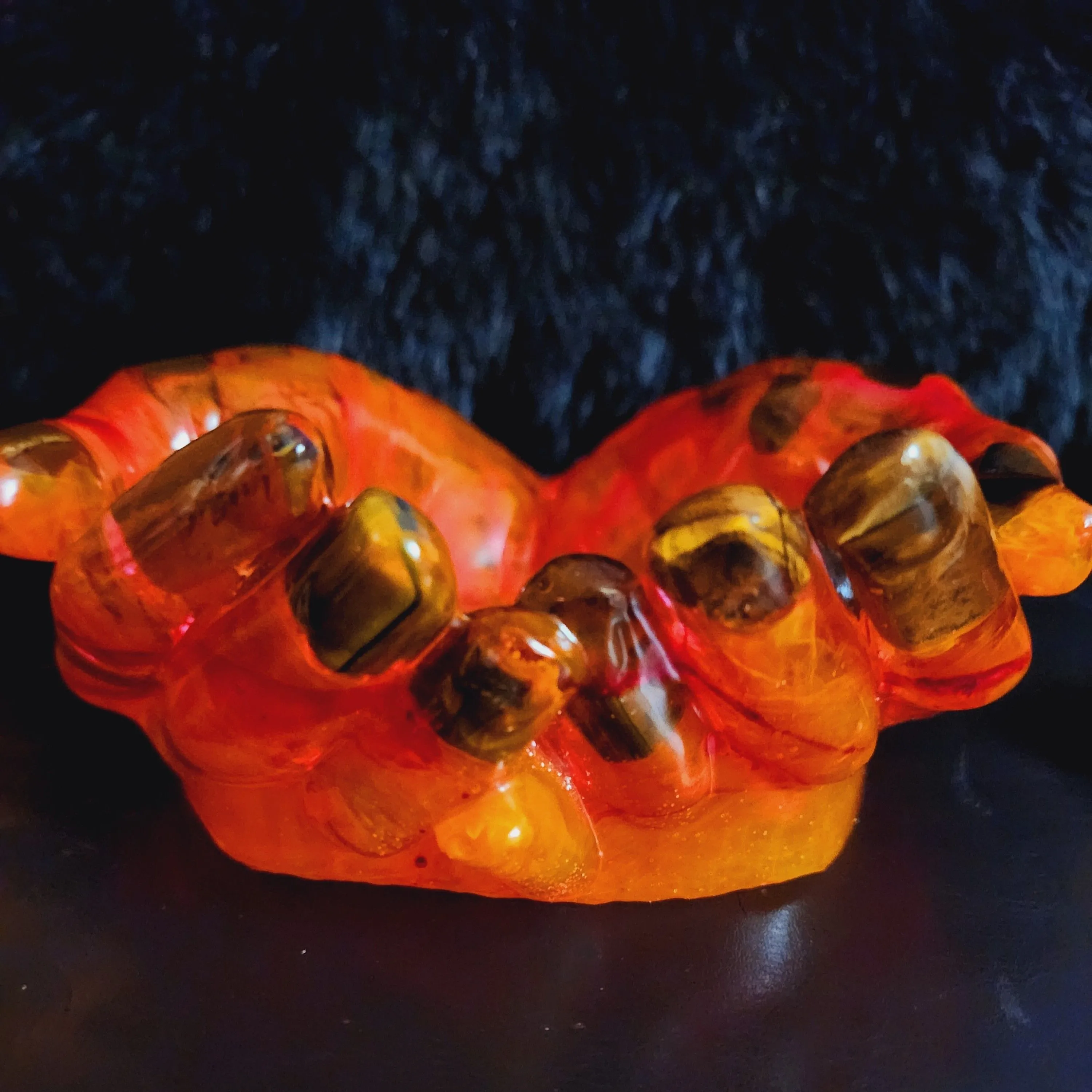 Product image for Epoxy life sized hands (hot hands) with tigers eye crystals