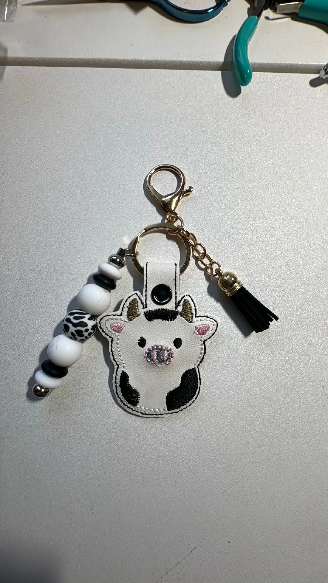 Product image for Cow embroidered keychain with beads