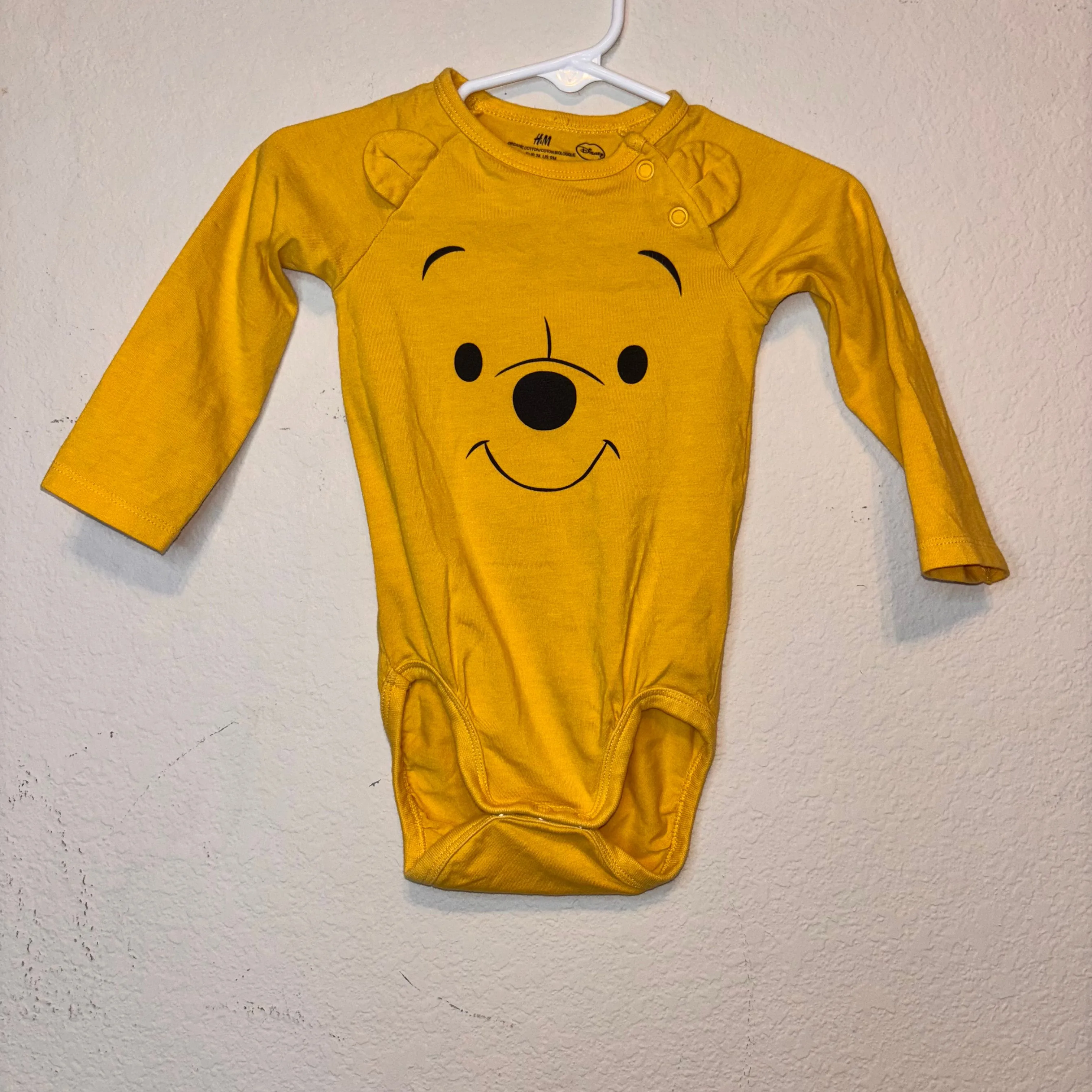Product image for 60L. Disney H&M Pooh Bear onesie, size 9 months