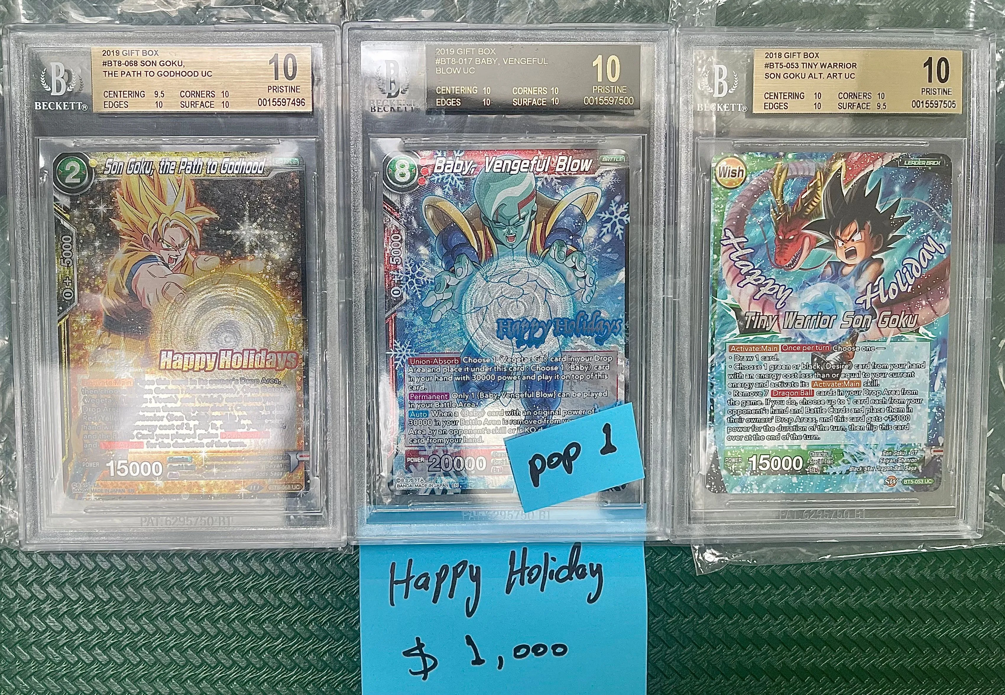 Product image for Dragon ball super card game BLACK LABEL pop 1:1 and two BGS 10 happy holiday