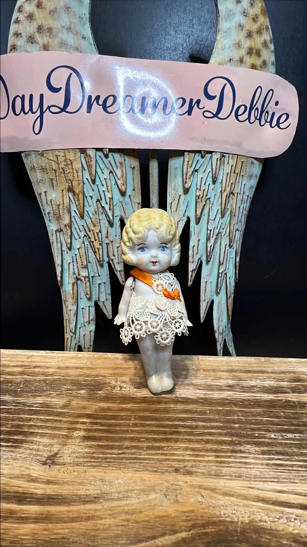 Product image for Doll 9. 1920s bisque doll with orange bow on dress.