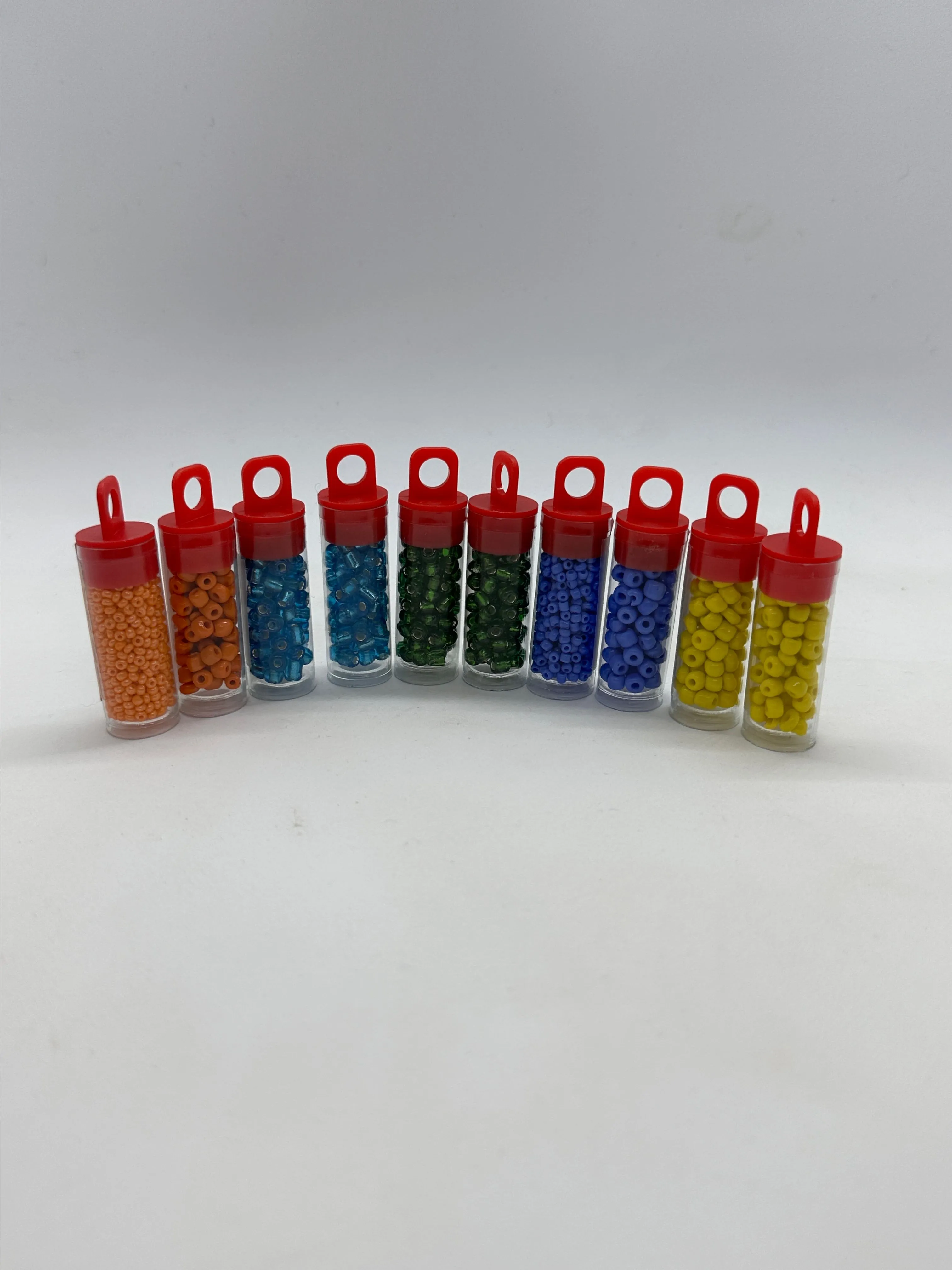 Product image for 10 small tubes of a variety of colors of beads MSRP: $15