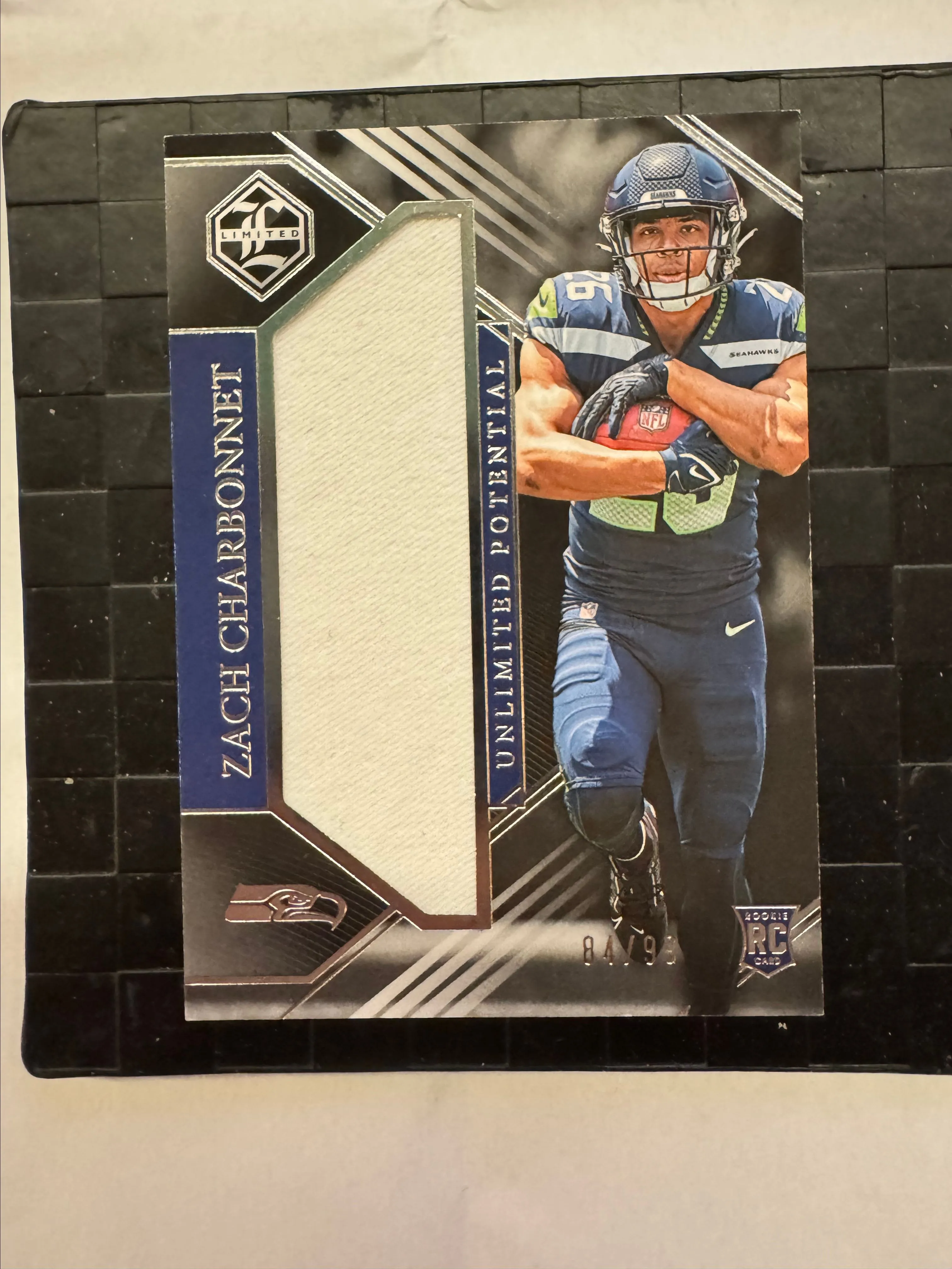 Product image for 2023 Panini Limited Football Unlimited Potential Zach Charbonnet RC /99 Patch Seattle Seahawks