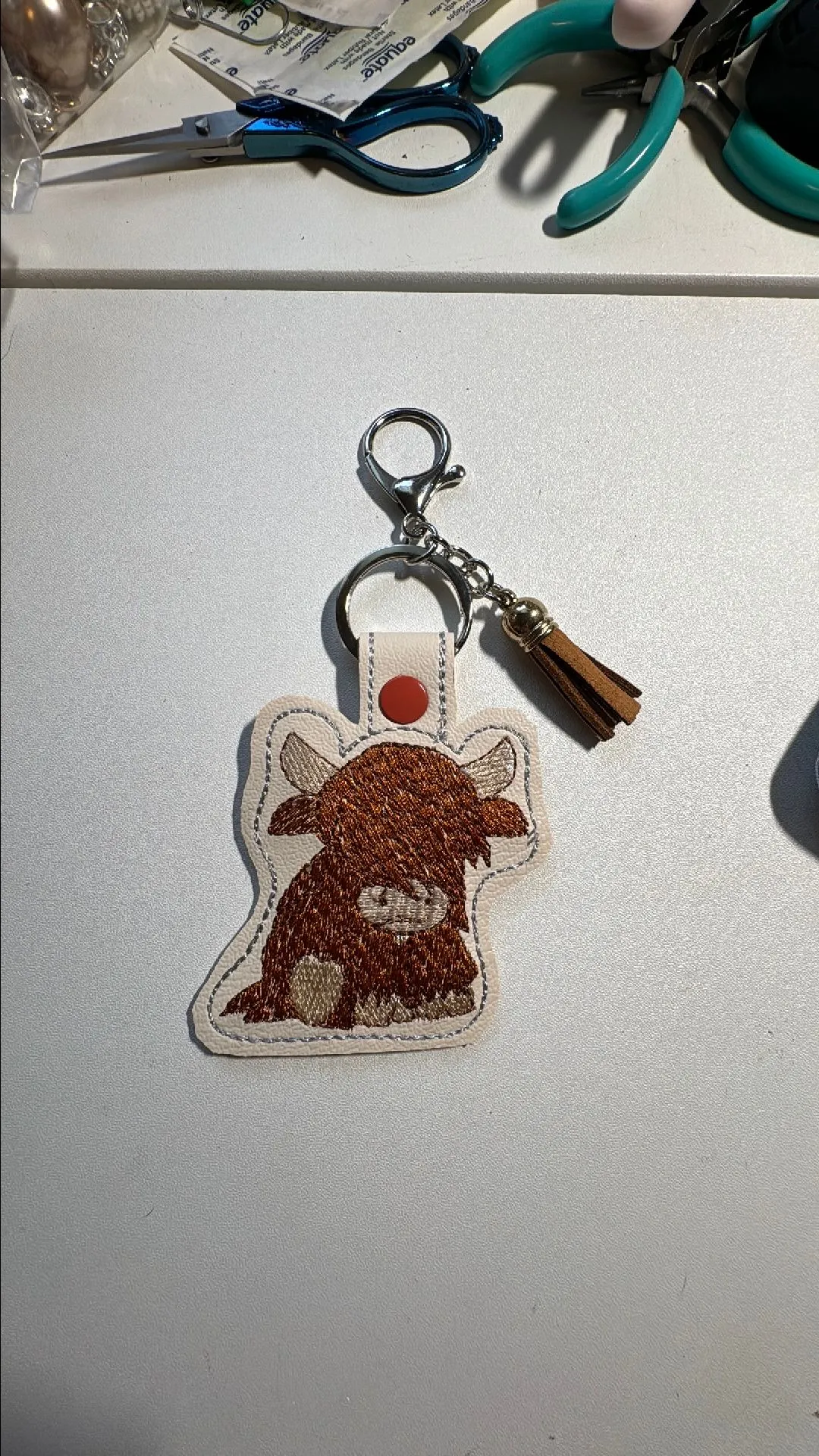 Product image for Highland cow embroidered keychain without beads