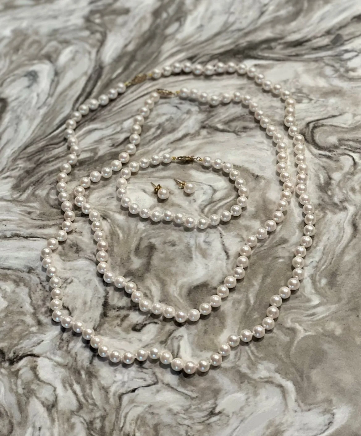 Product image for Akoya Pearl Set with 14KY Gold clasp, 18 & 24 Inch strands, 7.5 Inch Bracelet, and 7 MM Stud Earring