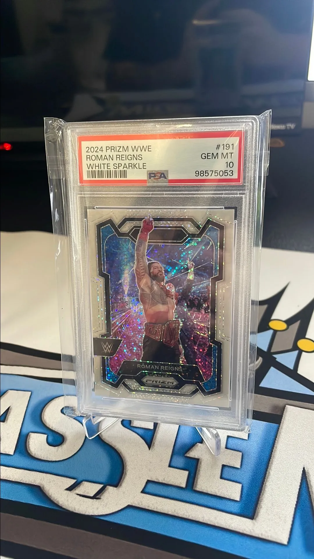 Product image for 2024 Prizm WWE Roman Reigns White Sparkle PSA 10
