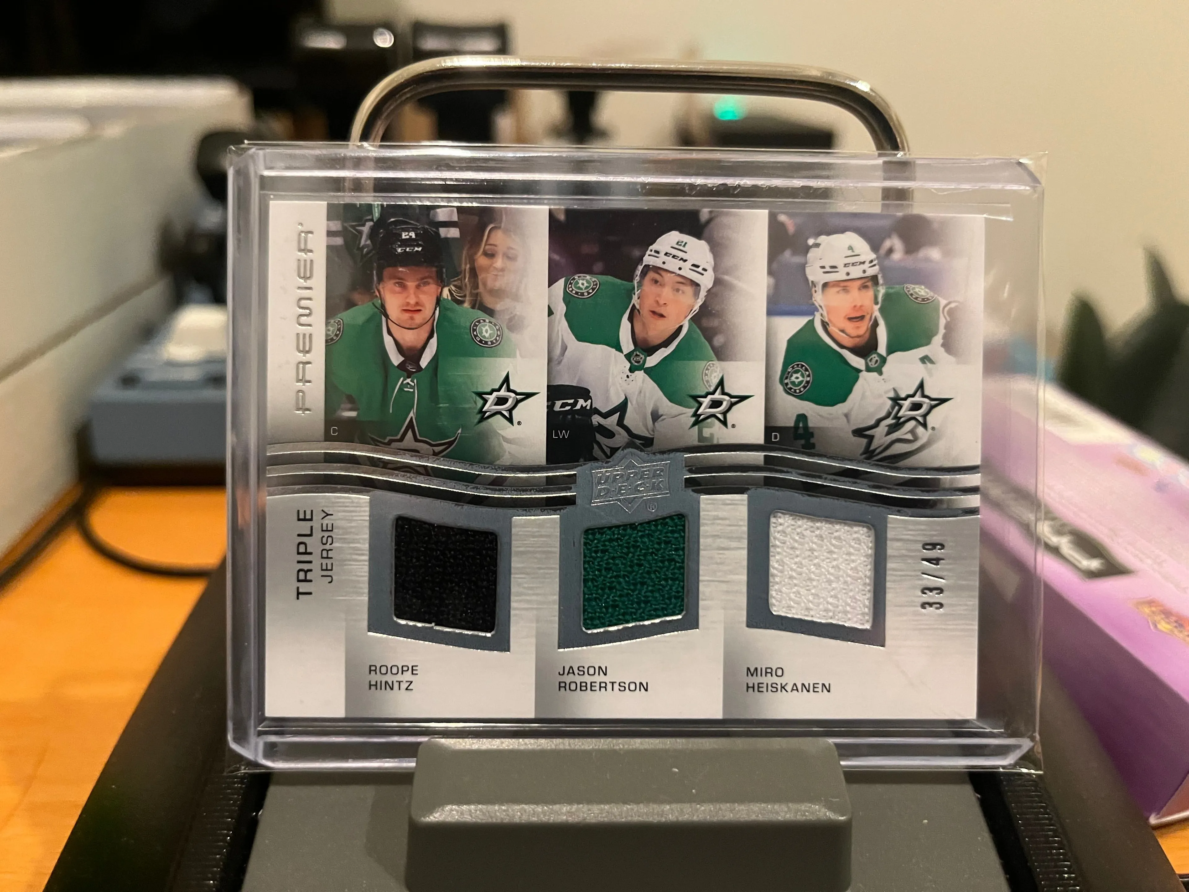 Product image for Hintz / Robertson / Heiskanen	Roope / Jason / Miro	Premier Triple Jersey Patch 3CLR 33/49 - Serial Numbered Game Used DAL Stars