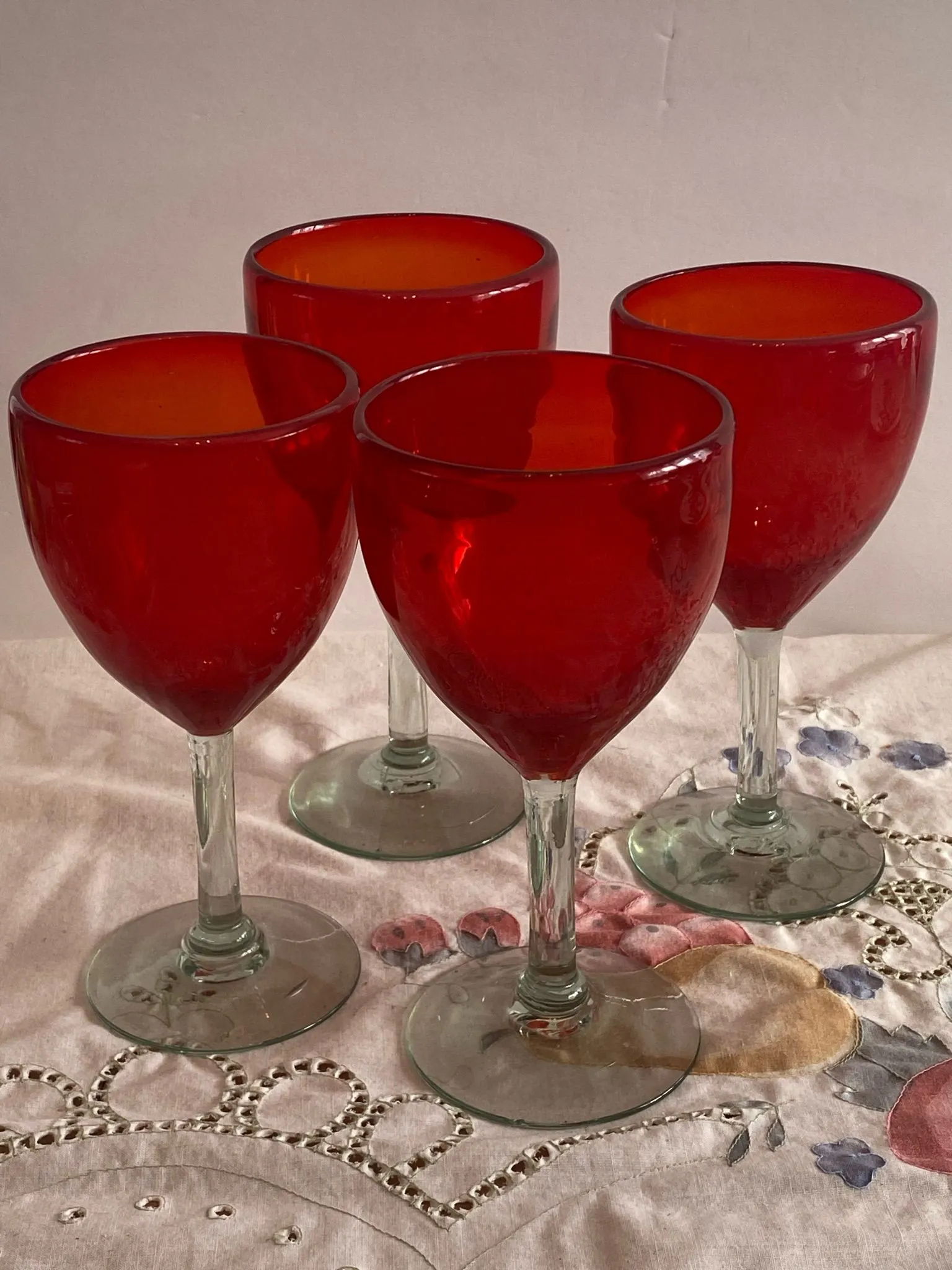 Product image for 4 red hand blown glass is with green tint. It stems seven 1/4 inch.