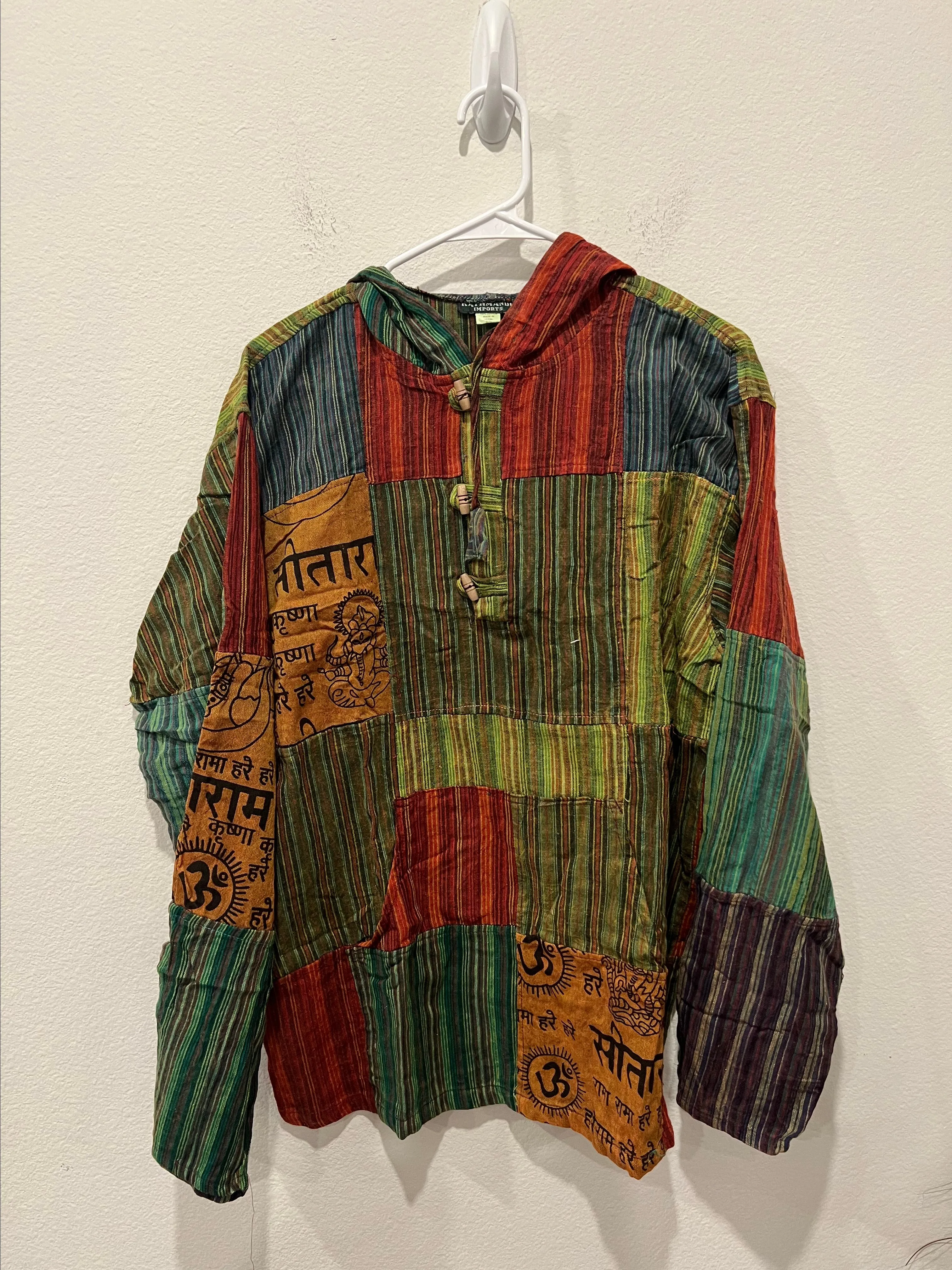 Product image for Multicolor Patchwork Hoodie with Wooden Buttons by Kathmandu