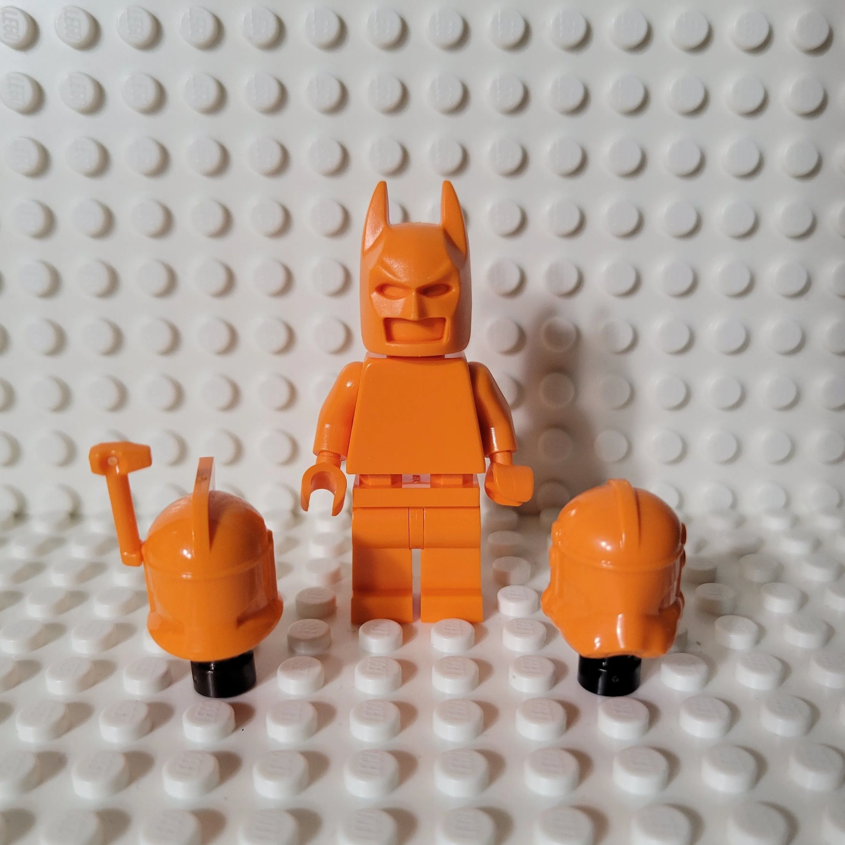 Product image for LEGO - SW & DC- Orange Monochrome figure w/ 3 interchangeable helmets 