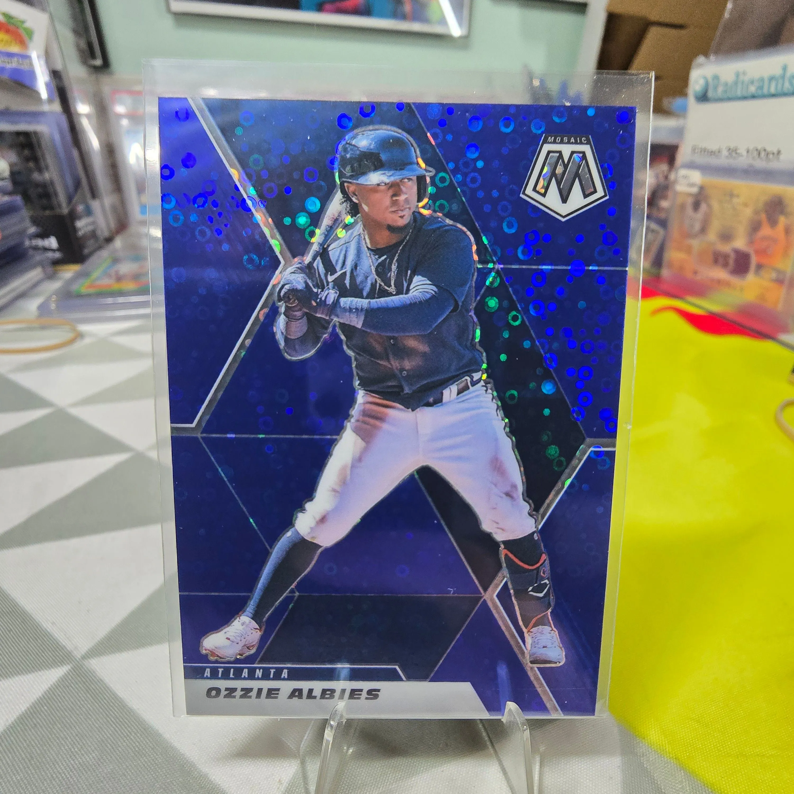 Product image for 2021 Panini Mosaic Quick Pitch Blue Mosaic Prizm /85 Ozzie Albies #64 Braves