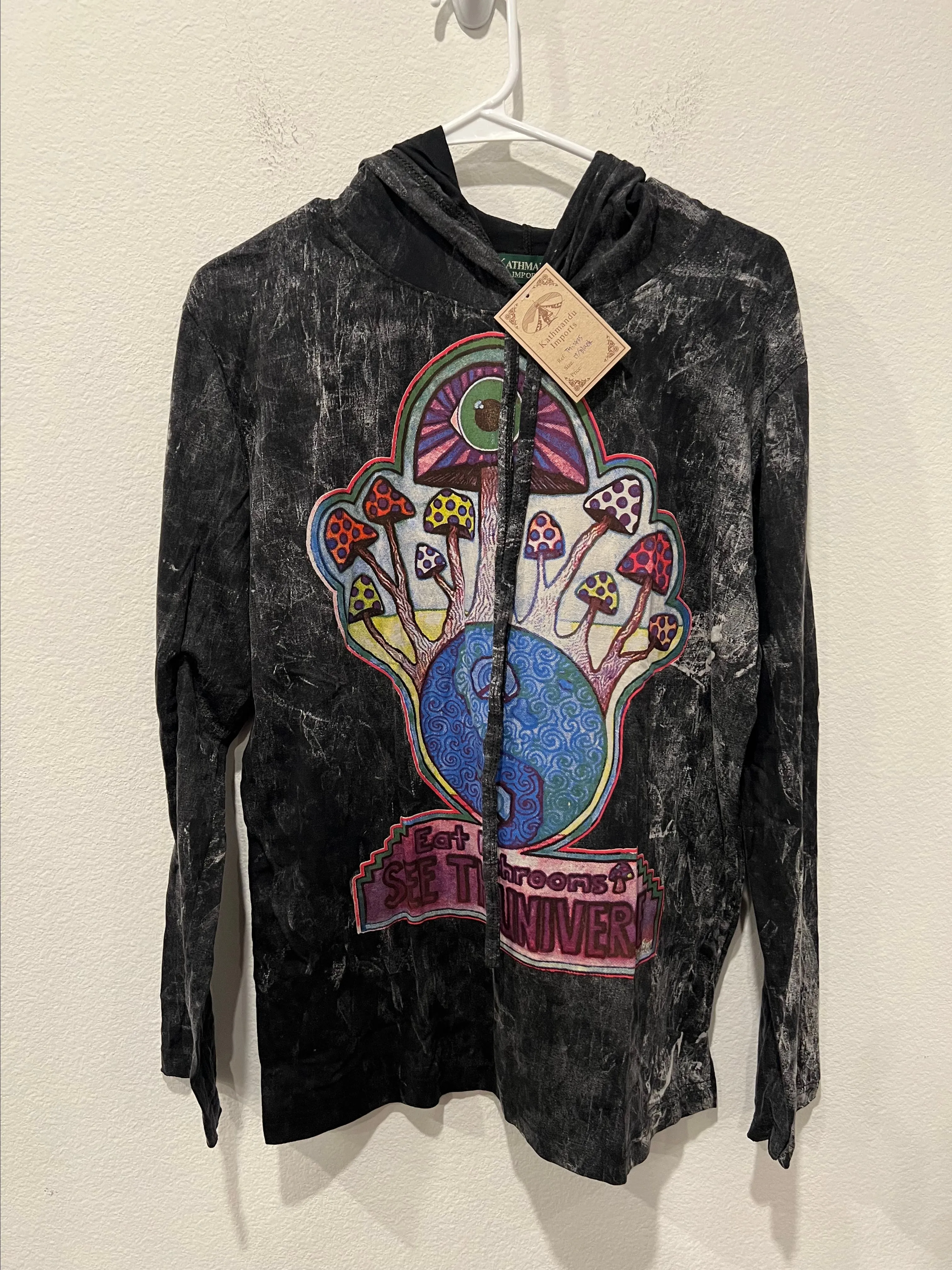 Product image for Black Graphic Hoodie with Colorful Design by Kathmandu