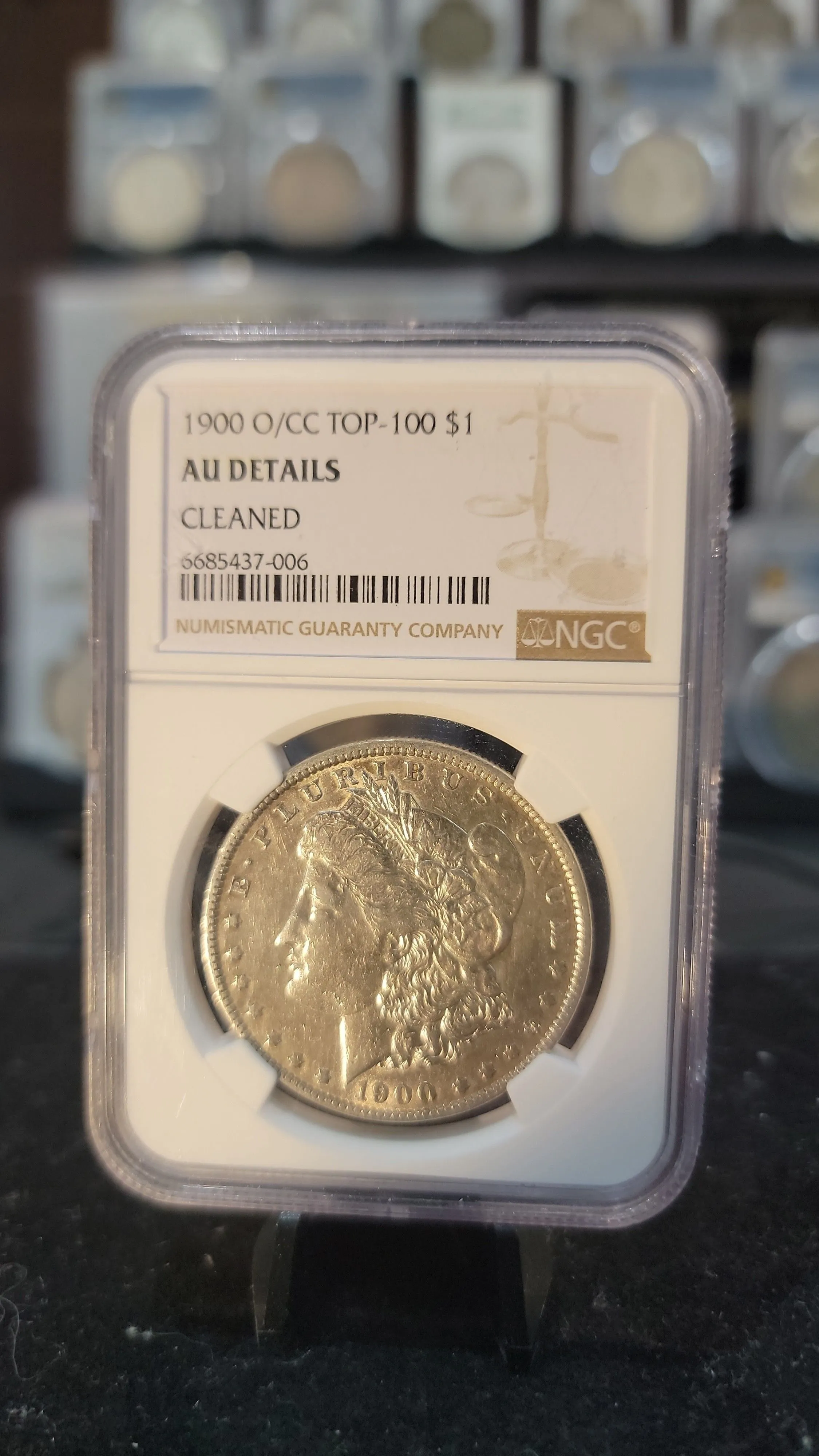 Product image for 1900 O/CC TOP 100 MORGAN DOLLAR NGC AU DETAILS