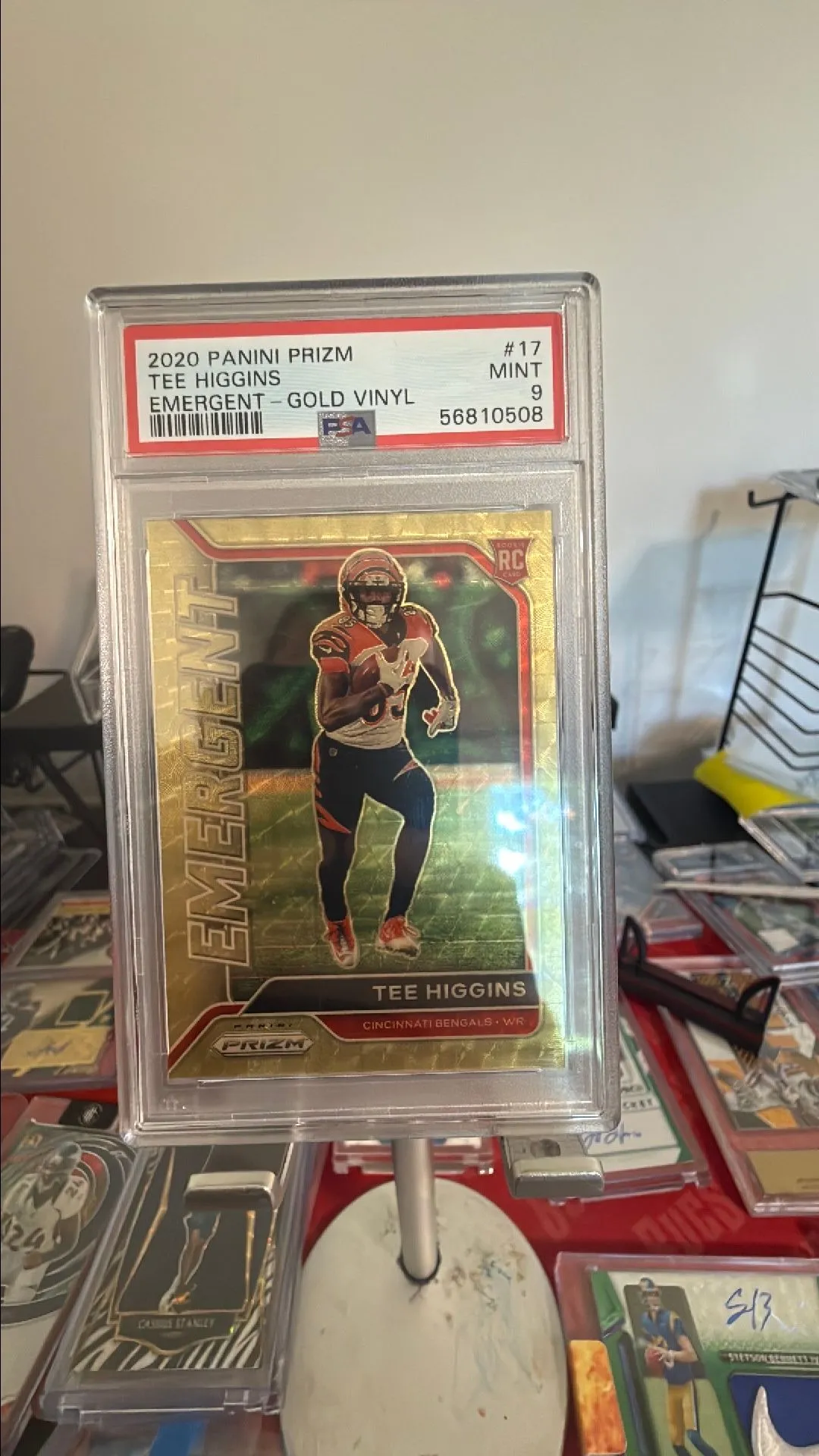 Product image for 2020 Prizm Tee Higgins Emergent Gold Vinal Rookie /5 PSA 9