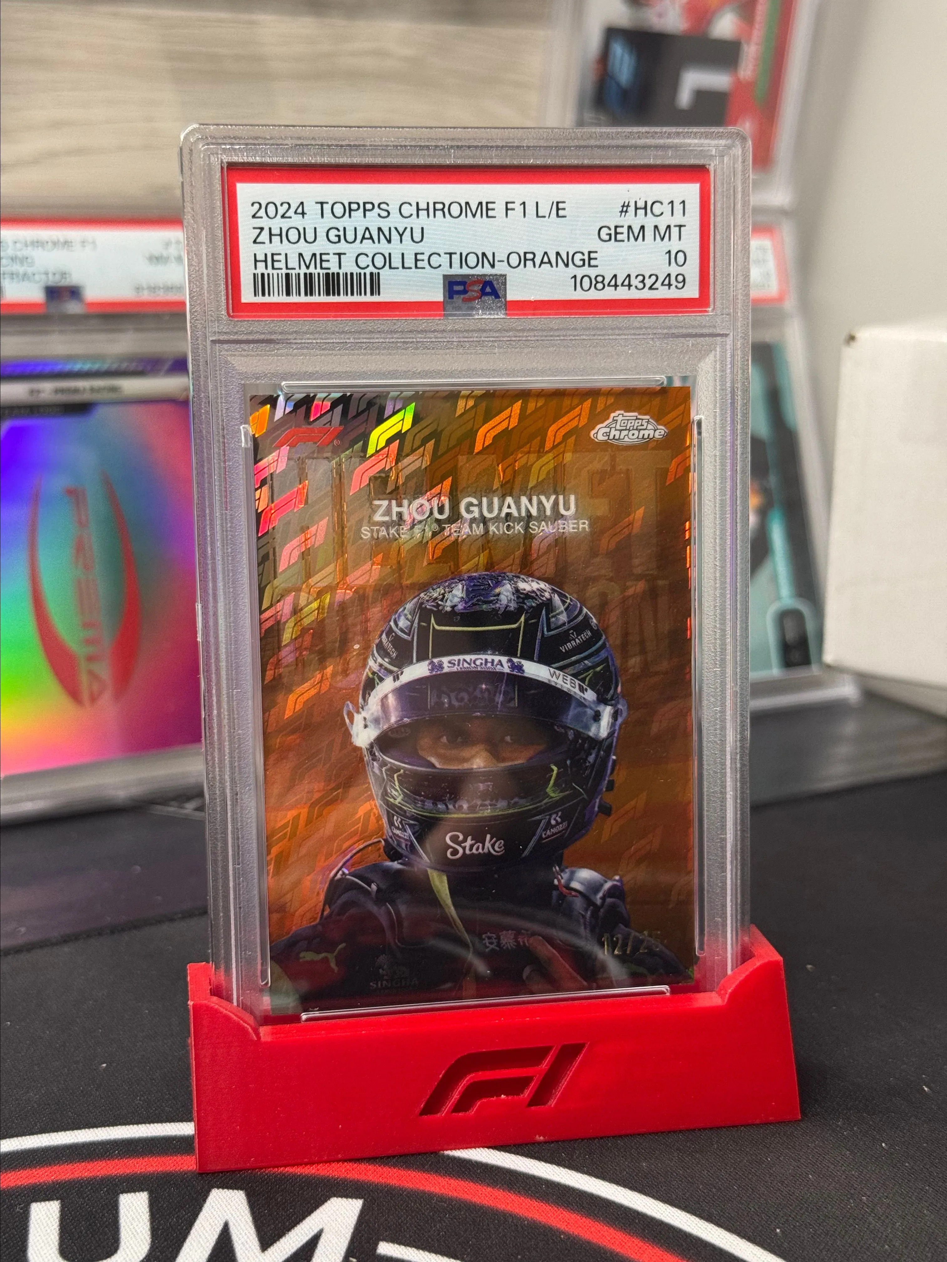 Product image for 2024 Topps Chrome Formula 1 Logofractor - Zhou Guanyu Orange Helmet /25 PSA 10