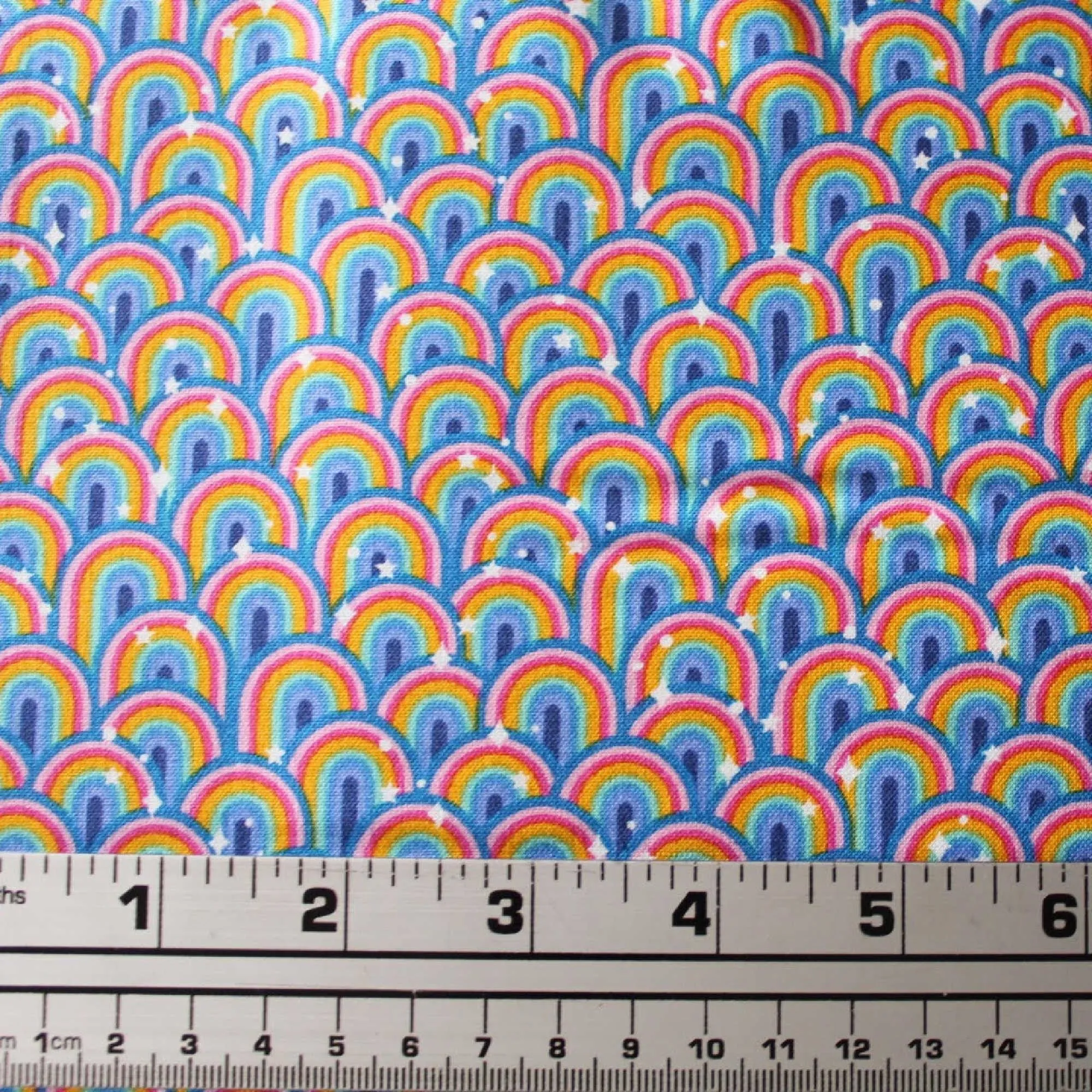 Product image for 1/2 yard. small rainbows 🌈 with white stars