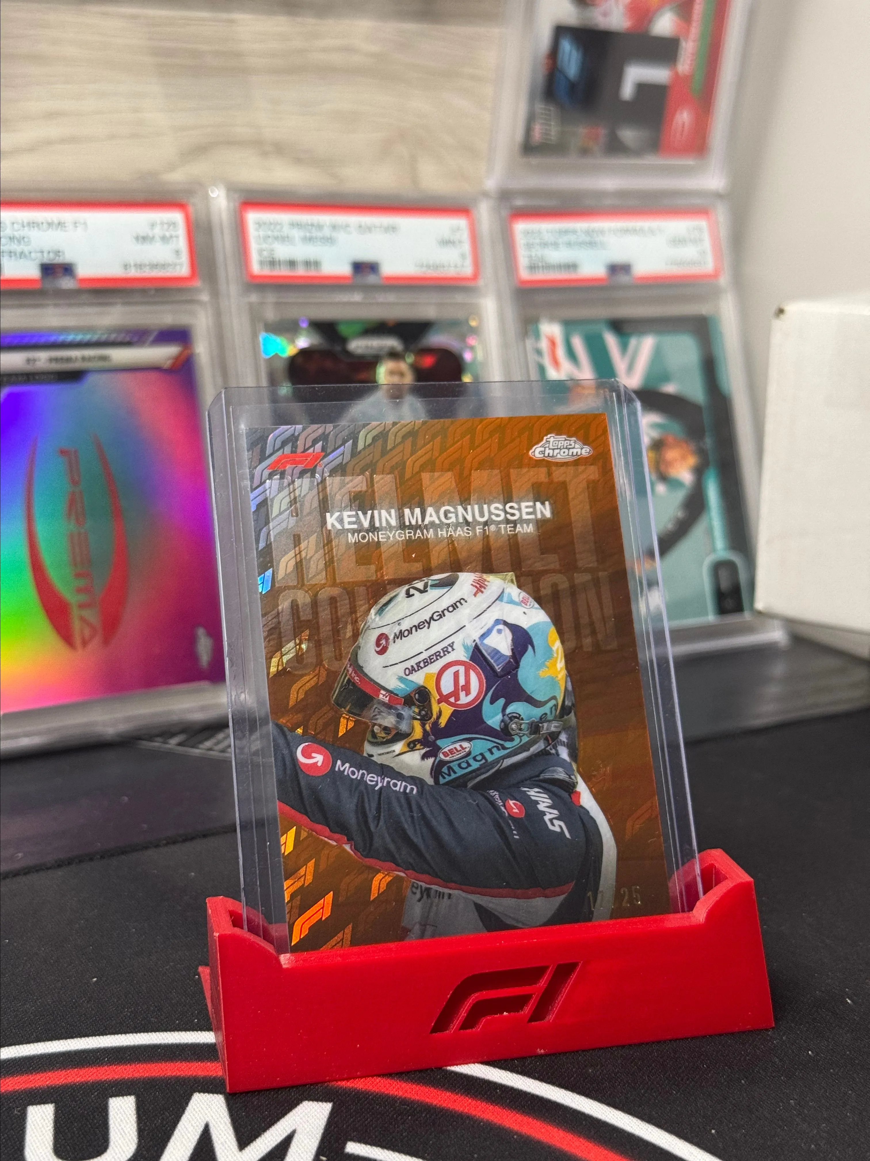 Product image for 2024 Topps Chrome Formula 1 Logofractor - Kevin Magnussen Orange Helmet /25
