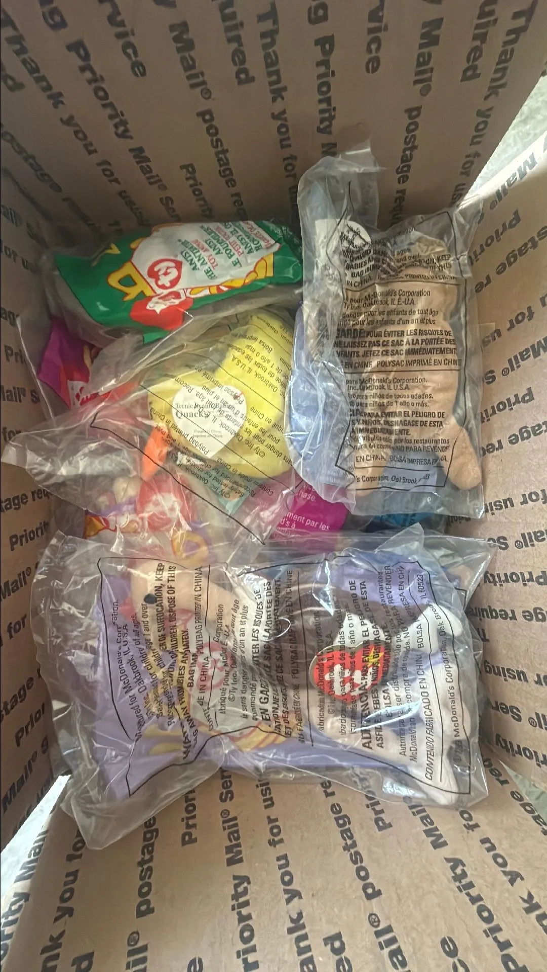 Product image for 35 teeny beanie babies stuffed in a medium flat rate box