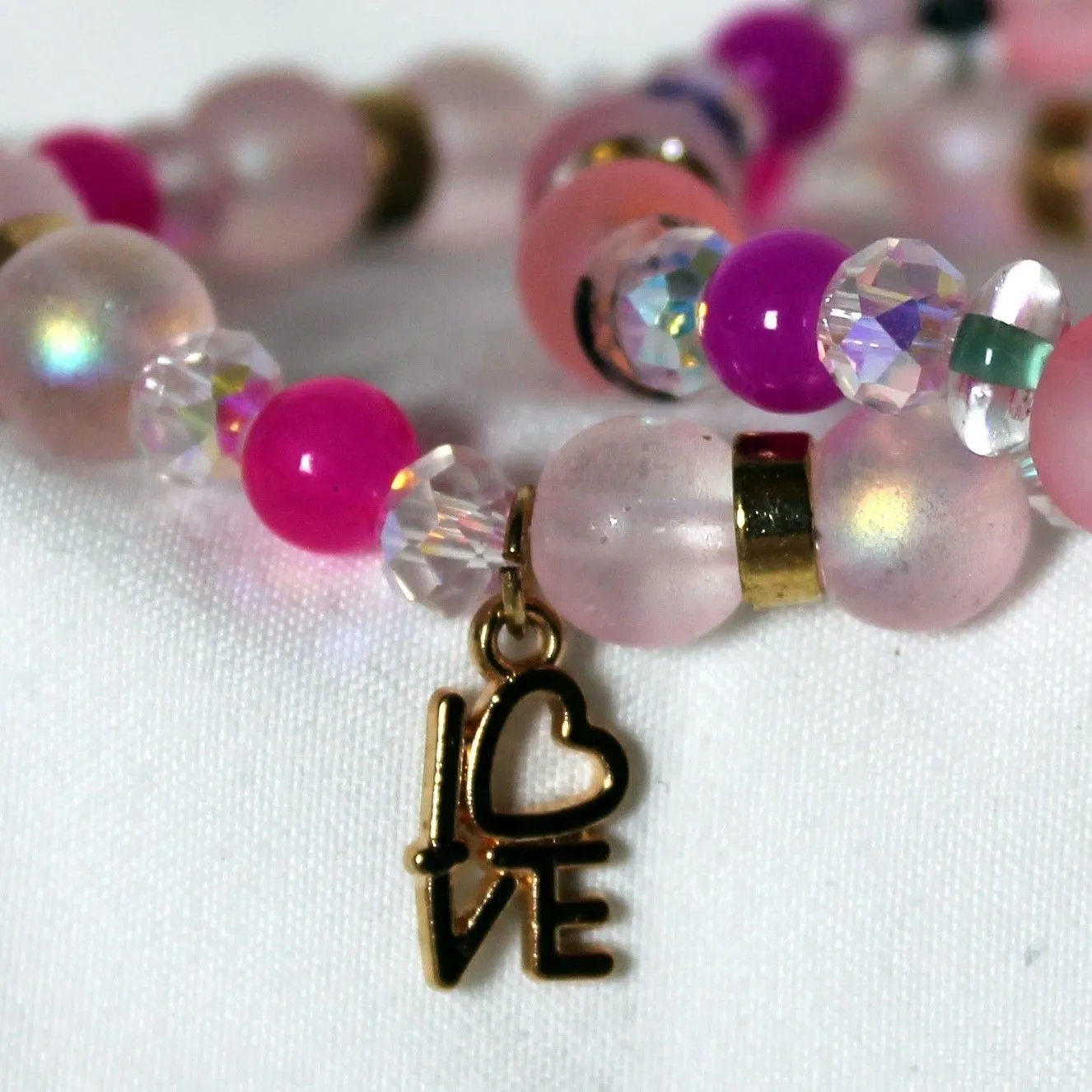 Product image for Love charm gold and pink bracelet