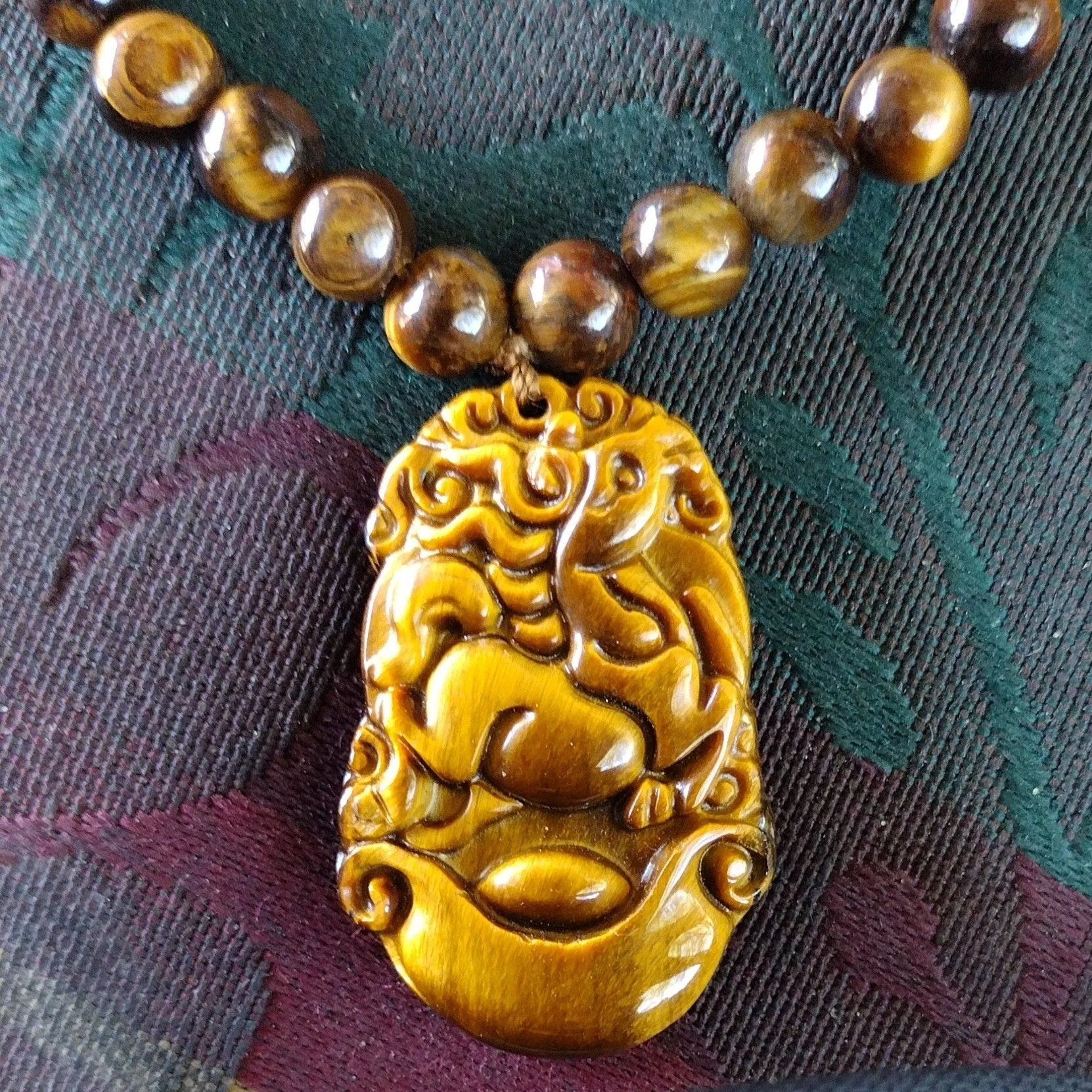 Product image for Carved Horse Tiger Eye Necklace