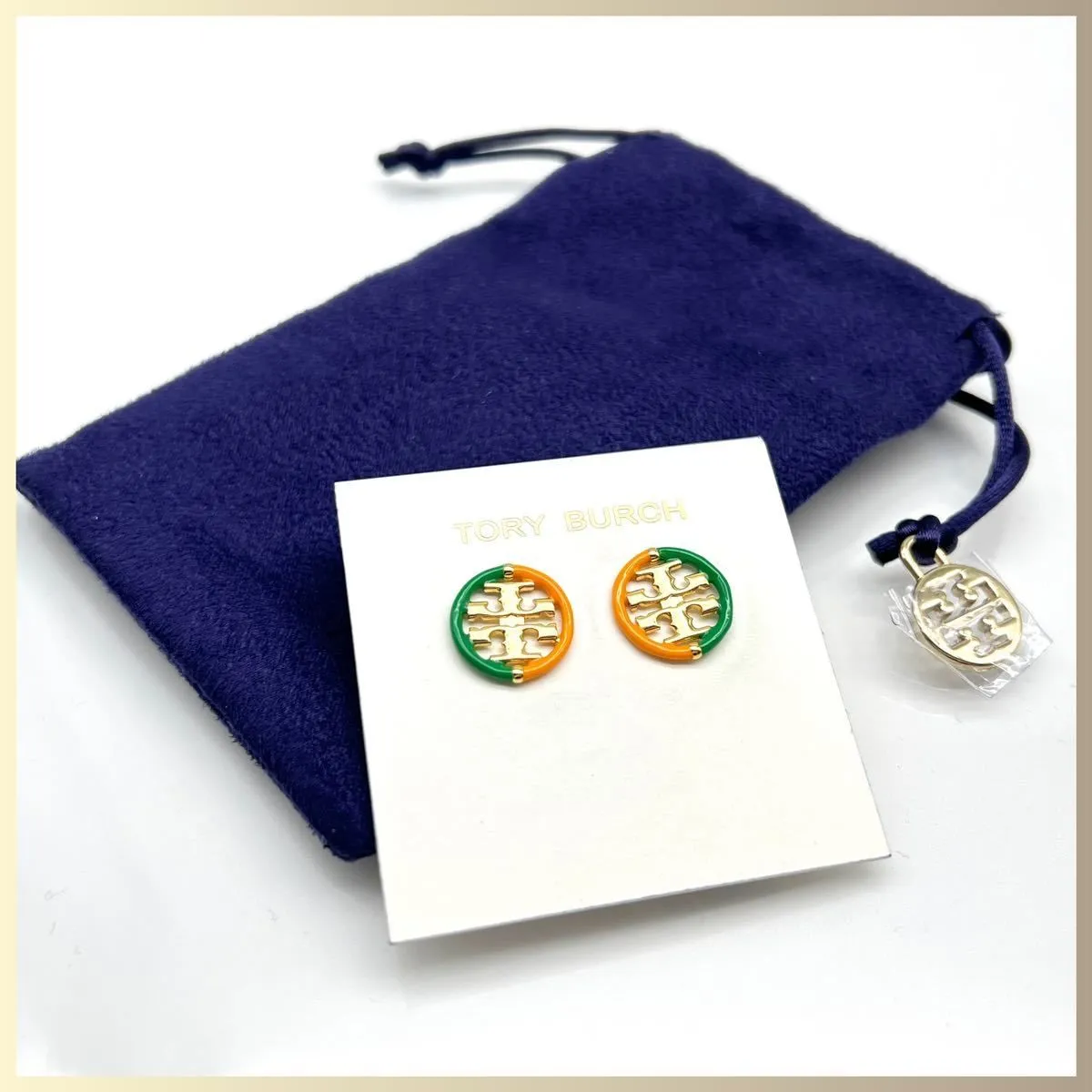 Product image for New Auth. Tory Burch Miller Studs Green and Orange on TB Earring Card.